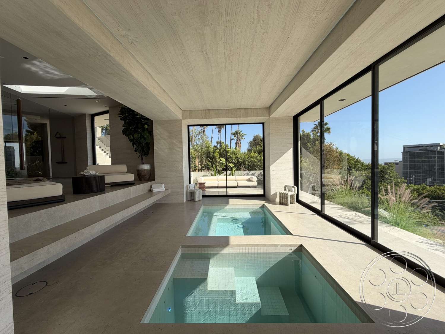 Modern 532 - minimalist design elements, smooth concrete flooring, large floor-to-ceiling windows, concrete textured walls, horizontal concrete ceiling, rectangular indoor plunge pools, split-level seating area, palm tree landscaping view