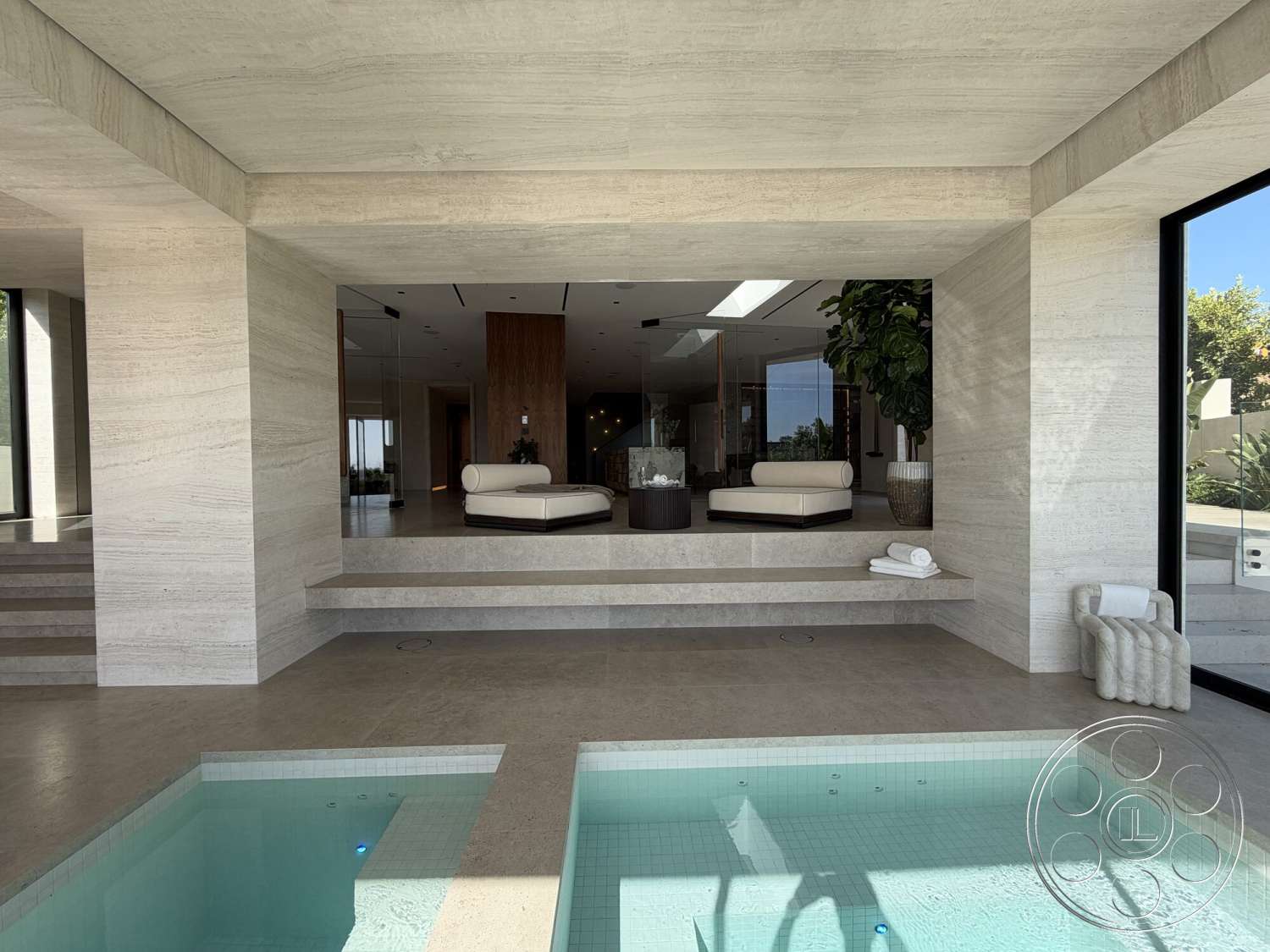 Modern 532 - floor-to-ceiling windows, wood accent wall, open-concept layout, exposed ceiling structure, circular planters, glass partition walls, modern minimalist design, potted indoor plants, travertine stone flooring, built-in lounge area, rectangular indoor pool, smooth travertine walls, low-profile pool deck, step-down living area