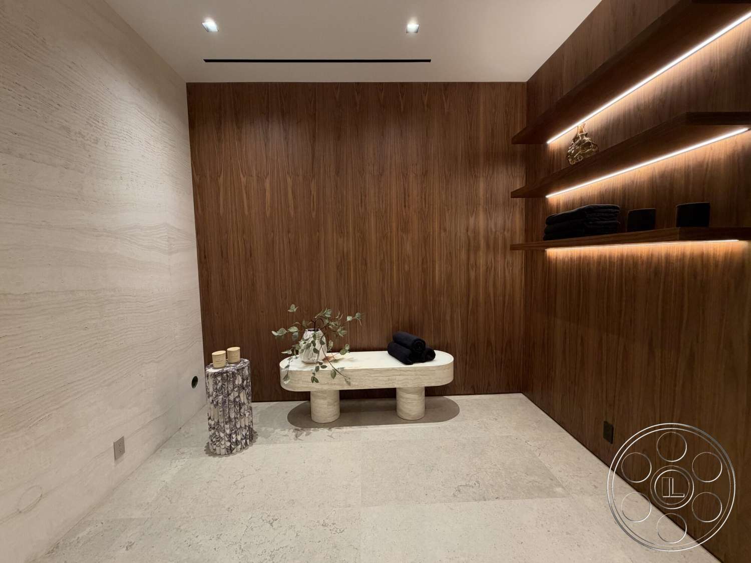 Modern 532 - minimalist decor, soft neutral color palette, concrete flooring, recessed lighting fixtures, floating wood shelves, textured plaster accent wall, marble accent table, custom wood paneling walls, sculptural side table design