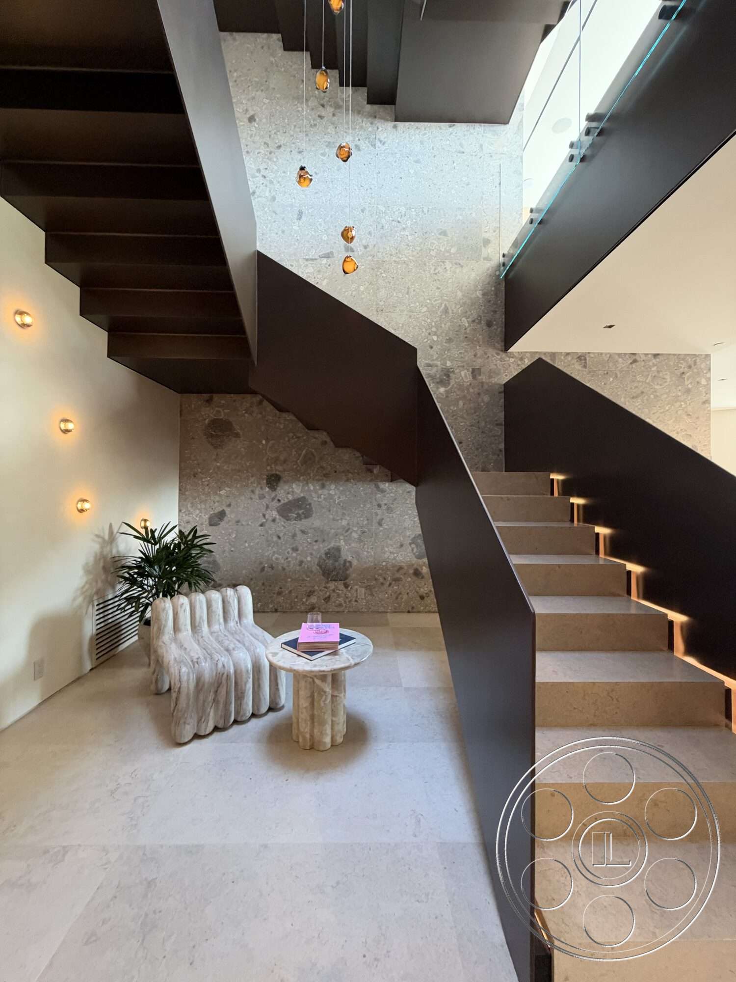 Modern 532 - plant decor, modern pendant lighting, exposed concrete walls, minimalist furniture, polished marble flooring, textured wall treatment, floating staircase, circular side table, steel handrail