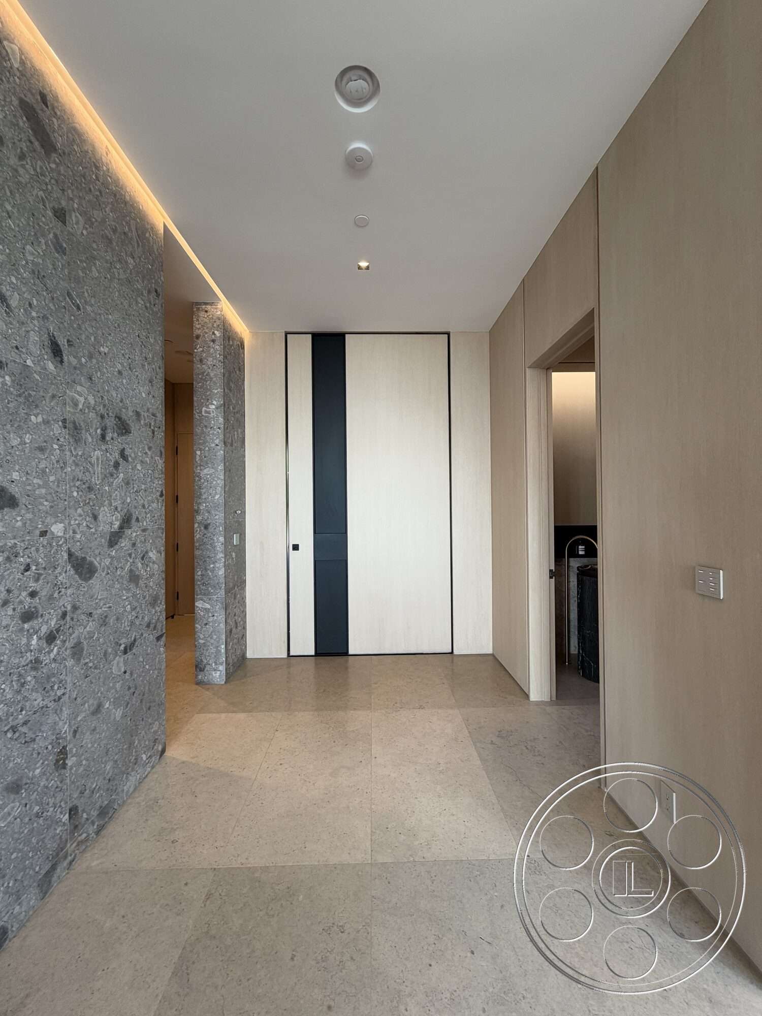 Modern 532 - minimalist design, open floor plan, beige stone flooring, light wood paneling, recessed ceiling lighting, smooth wall finish, polished stone wall, sliding door with black accent