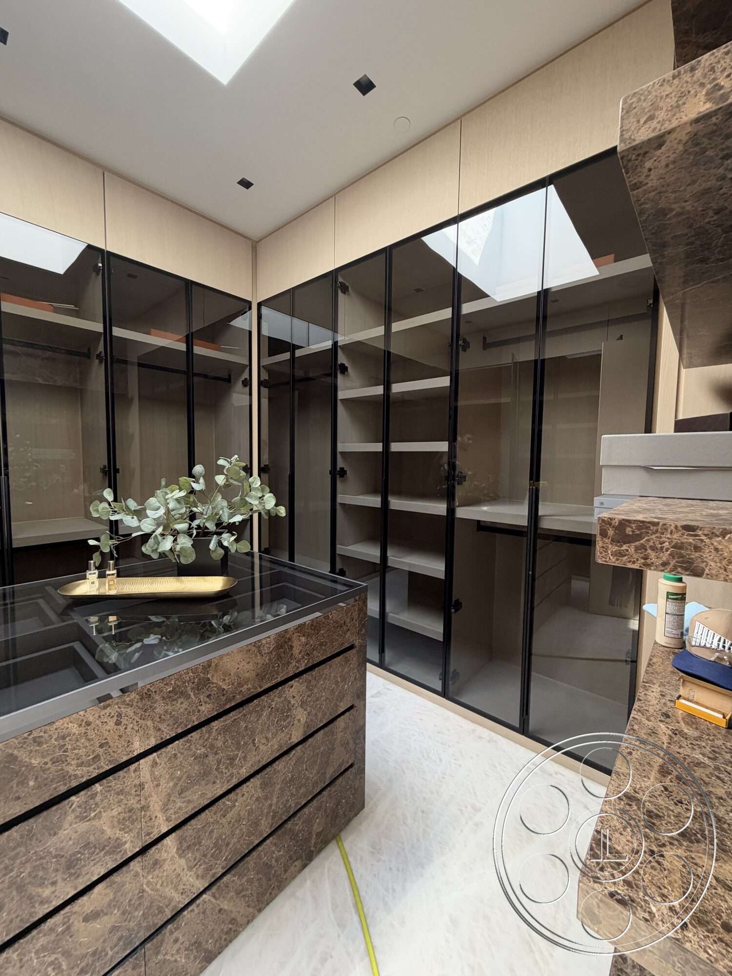 Modern 532 - open shelving, marble countertop, glass display cabinets, modern minimalist design, skylight ceiling, black hardware details, white tile flooring, laminate cabinetry