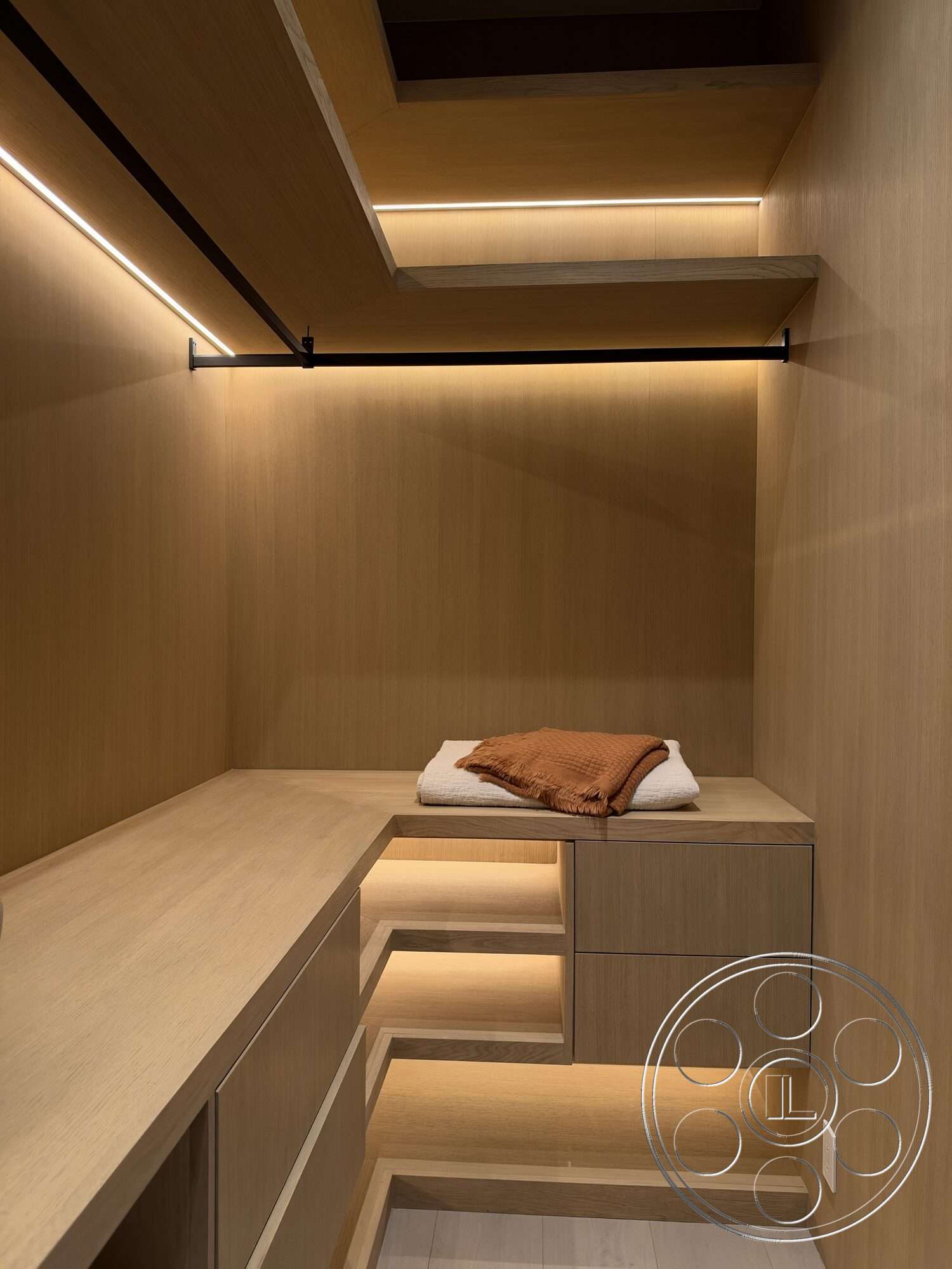 Modern 532 - neutral color palette, minimalist design, cozy atmosphere, open layout, custom cabinetry, built-in storage, light wood paneling, light wood shelving, LED strip lighting, clothes hanging rod