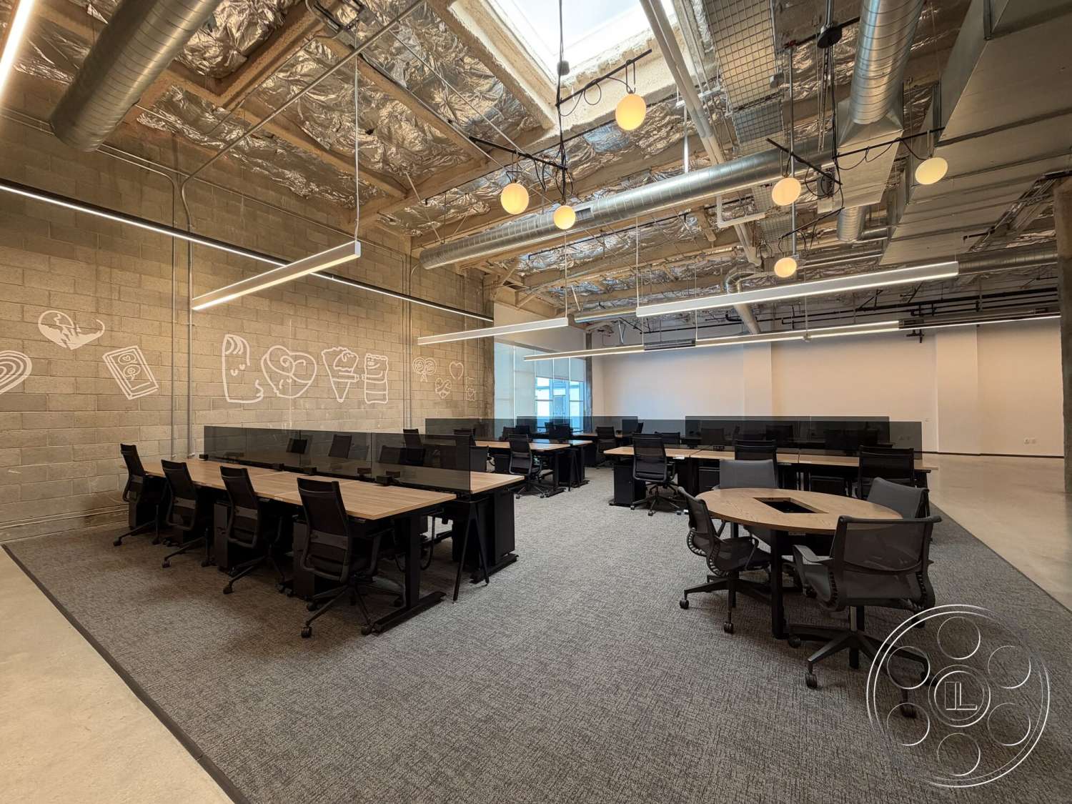 Office 130 - neutral color palette, polished concrete flooring, exposed concrete walls, industrial style, collaborative workspace, linear pendant lighting, open office layout, ergonomic office chairs, glass partition walls, carpet office flooring, modular office desks, interior workspace, metal ceiling beams