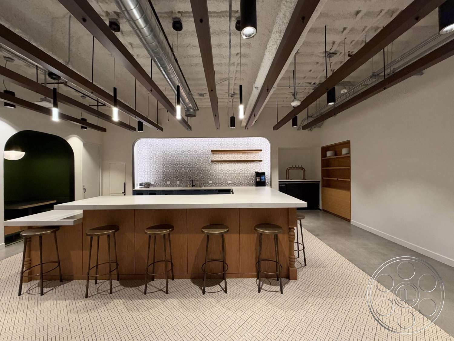 Office 130 - neutral color palette, minimalist design, wooden bar stools, concrete flooring, modern pendant lighting, textured ceiling, glass cabinet doors, decorative tile backsplash, exposed wood ceiling beams, white painted walls, marble kitchen island, open kitchen shelving