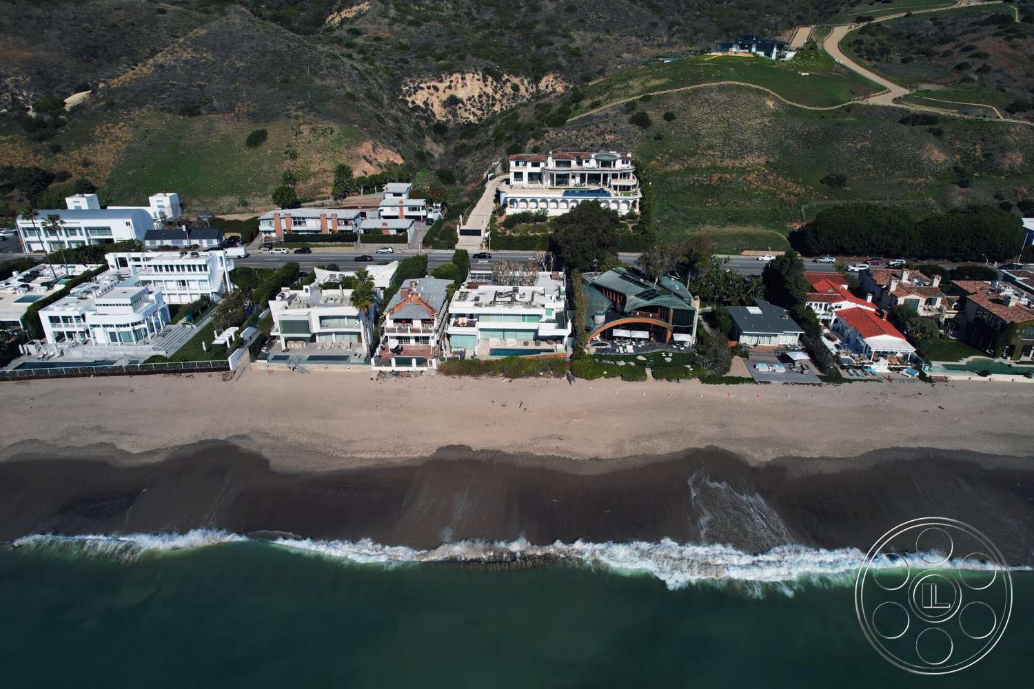 Medit 169 - exterior, paved driveway, landscaped gardens, floor-to-ceiling windows, concrete walkways, flat roof design, stucco exterior walls, glass balcony railings, oceanfront setting, modern beachfront homes, gabled roof accents, coastal dunes, wavy shoreline
