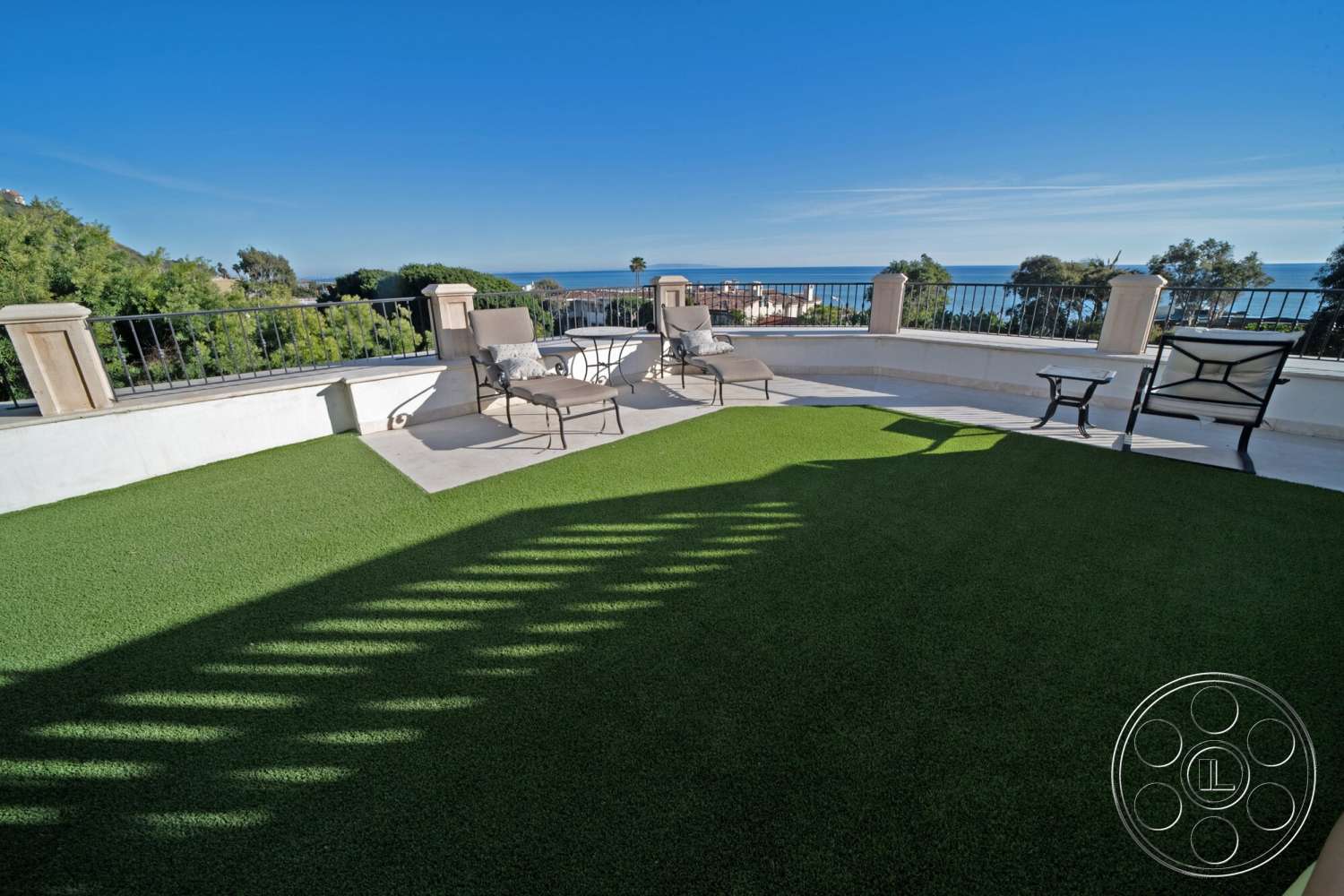 Medit 169 - exterior, potted plants, metal railing, coastal view, modern outdoor lounge area, sunny terrace, artificial turf patio flooring, oceanfront setting, concrete balcony surface, decorative outdoor furniture