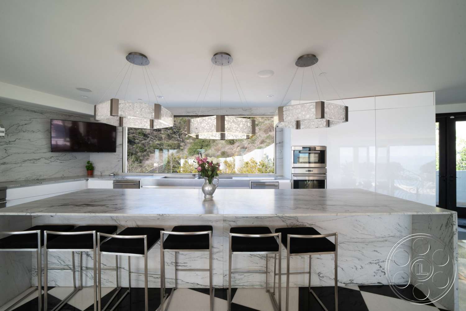 Medit 169 - stainless steel appliances, open concept layout, modern pendant lighting, floor-to-ceiling windows, white cabinetry, marble countertop, black and white checkered flooring, contemporary kitchen design, marble kitchen island, textured marble wall treatment, views of natural surroundings