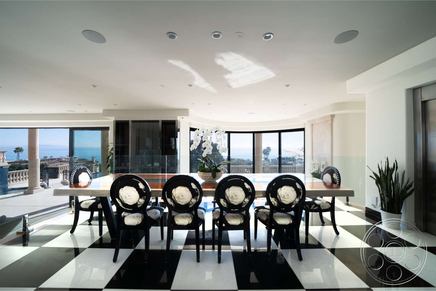 Medit 169 - minimalist decor, natural lighting, floor-to-ceiling windows, modern architectural style, ocean view, contemporary dining area, glass partition walls, smooth plaster walls, elegant interior design, black and white checkered tile floors, polished wood dining table, upholstered dining chairs with floral pattern
