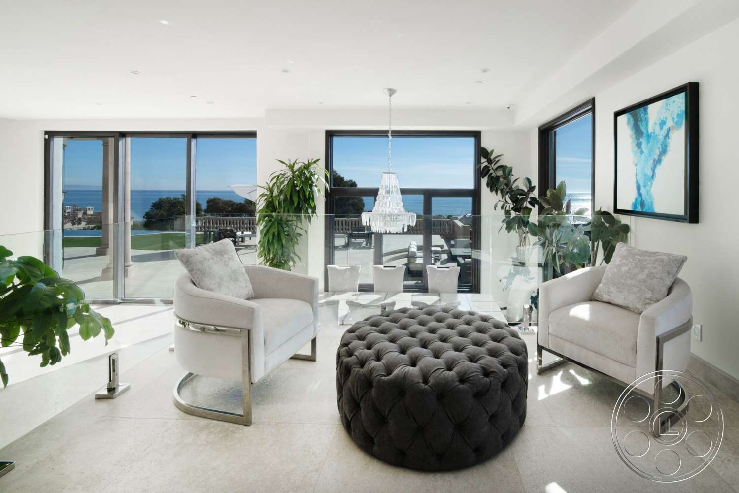 Medit 169 - minimalist decor, natural light, exterior, indoor plants, floor-to-ceiling windows, ocean view, open concept living space, modern chandelier, tufted ottoman, stone tile flooring, white painted walls, glass balcony railings, plush accent chairs
