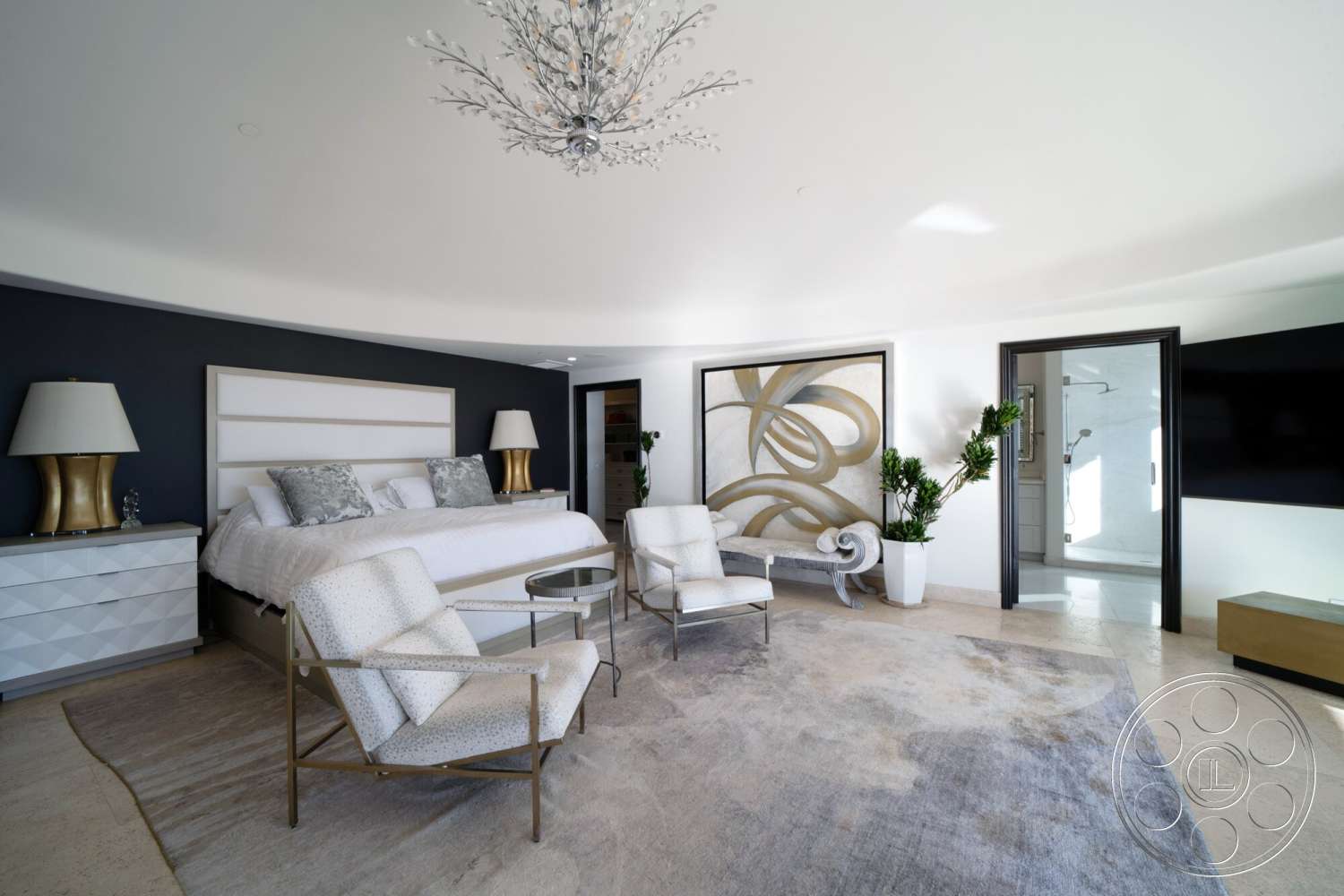 Medit 169 - neutral color palette, indoor plants, floor-to-ceiling windows, decorative wall art, sliding glass door, soft area rug, textured wall treatment, glass chandelier, white armchairs, natural light flooding the room, ceramic table lamp, luxury seating area, white upholstered bed, round ceiling, dark blue accent wall, gold accent nightstands, gold metal coffee table, spa-like bathroom access