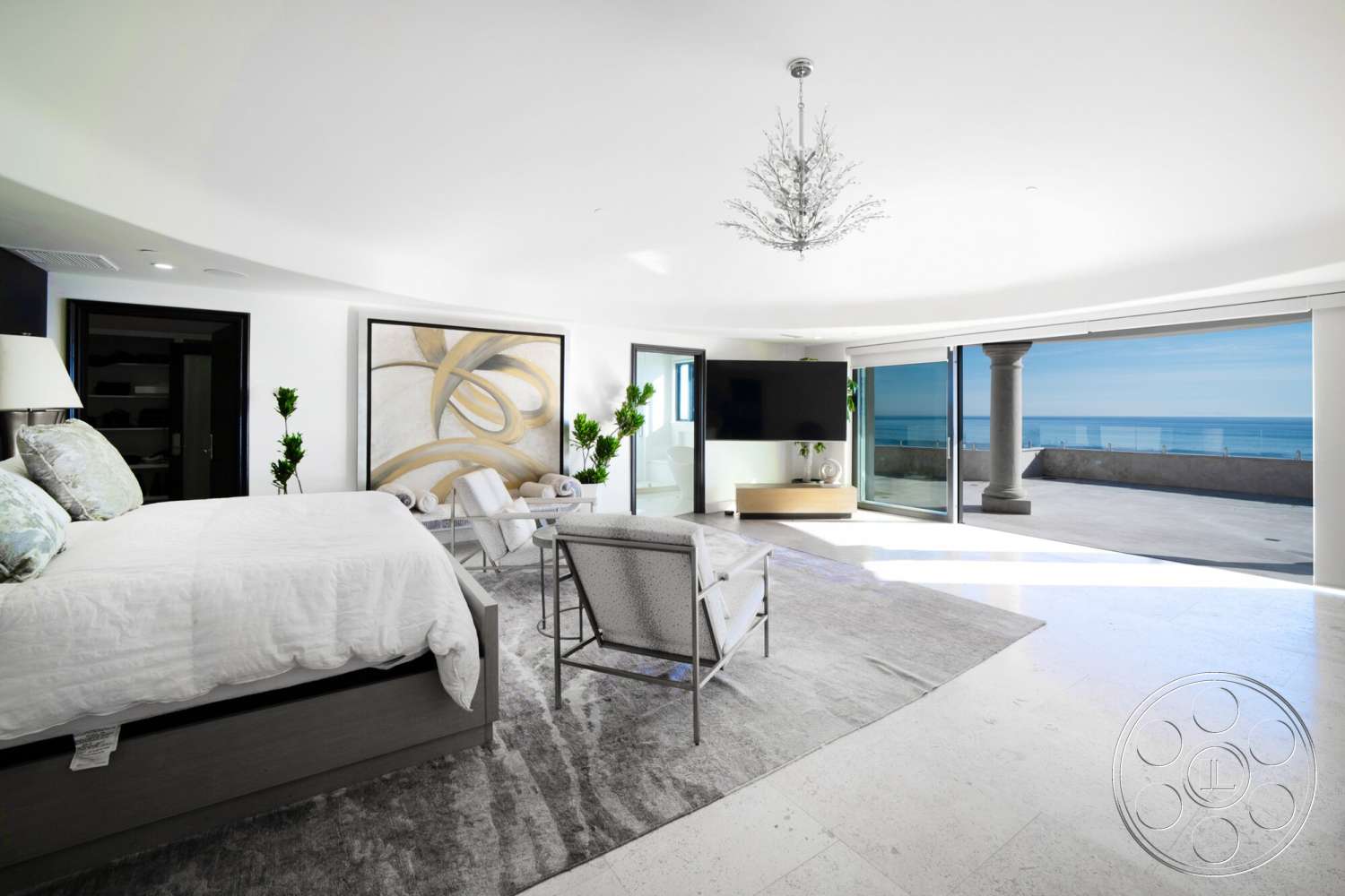 Medit 169 - textured area rug, glass sliding doors, potted greenery, ocean view, marble flooring, modern accent chairs, king-size upholstered bed, interior luxurious bedroom, oval chandelier, decorative abstract wall art, minimalist wooden TV console, corner column detail