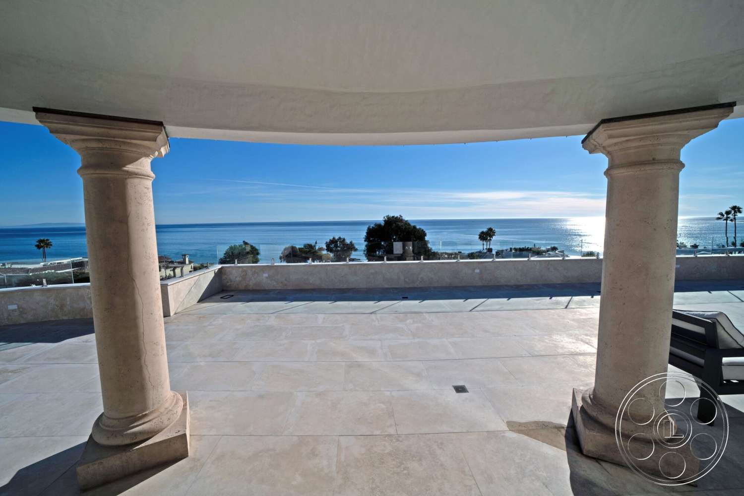 Medit 169 - exterior, open-air design, coastal setting, sea view, sunlit terrace, smooth surface, marble patio flooring, concrete wall perimeter, circular column supports