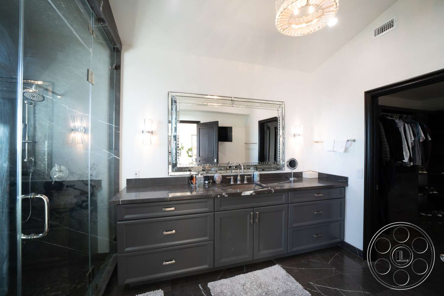 Medit 169 - glass shower enclosure, modern pendant lighting, chrome faucet fixtures, luxury bathroom design, marble bathroom flooring, textured white plaster walls, dark wood vanity cabinets, slate shower walls, mirrored bathroom mirror, polished chrome lighting fixtures, black framed doorways