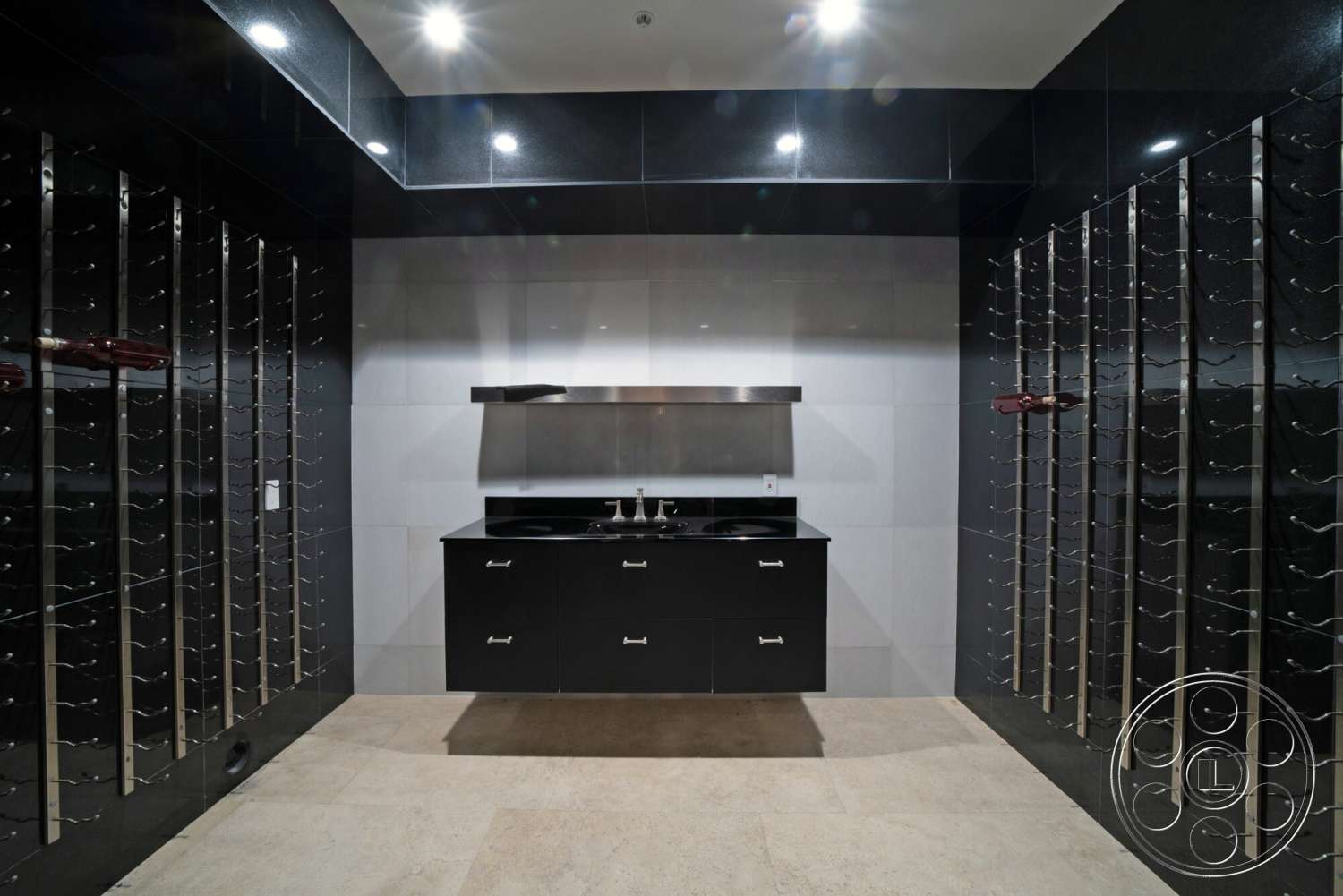 Medit 169 - modern architectural style, black granite countertop, beige tile flooring, recessed ceiling lights, interior wine cellar, dark wood wine storage racks, exposed stainless steel shelving, high-gloss black wall panels