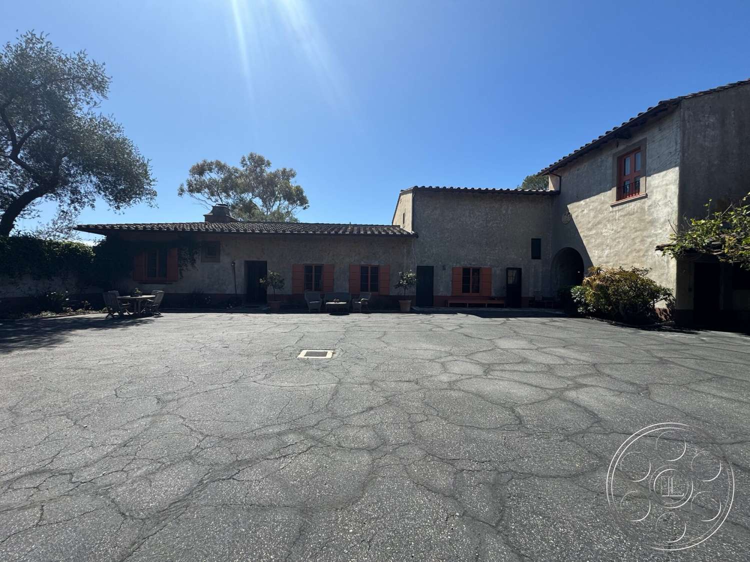 Farmstead Garden - exterior, landscaped garden, outdoor seating area, asphalt driveway, stucco exterior walls, paved courtyard area, terracotta tiled roof, red wooden window shutters