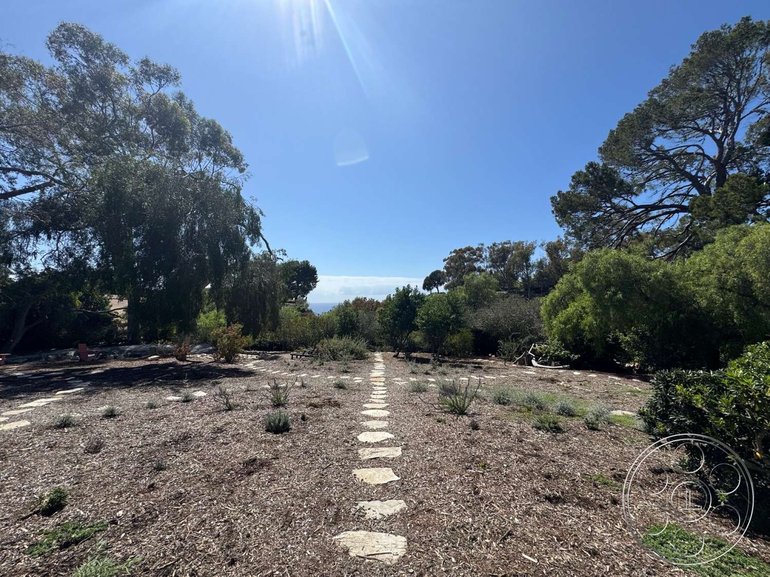 Farmstead Garden - exterior, mature trees, stone pathway, hillside setting, landscape garden, native shrubs, open sky view, natural mulch ground cover