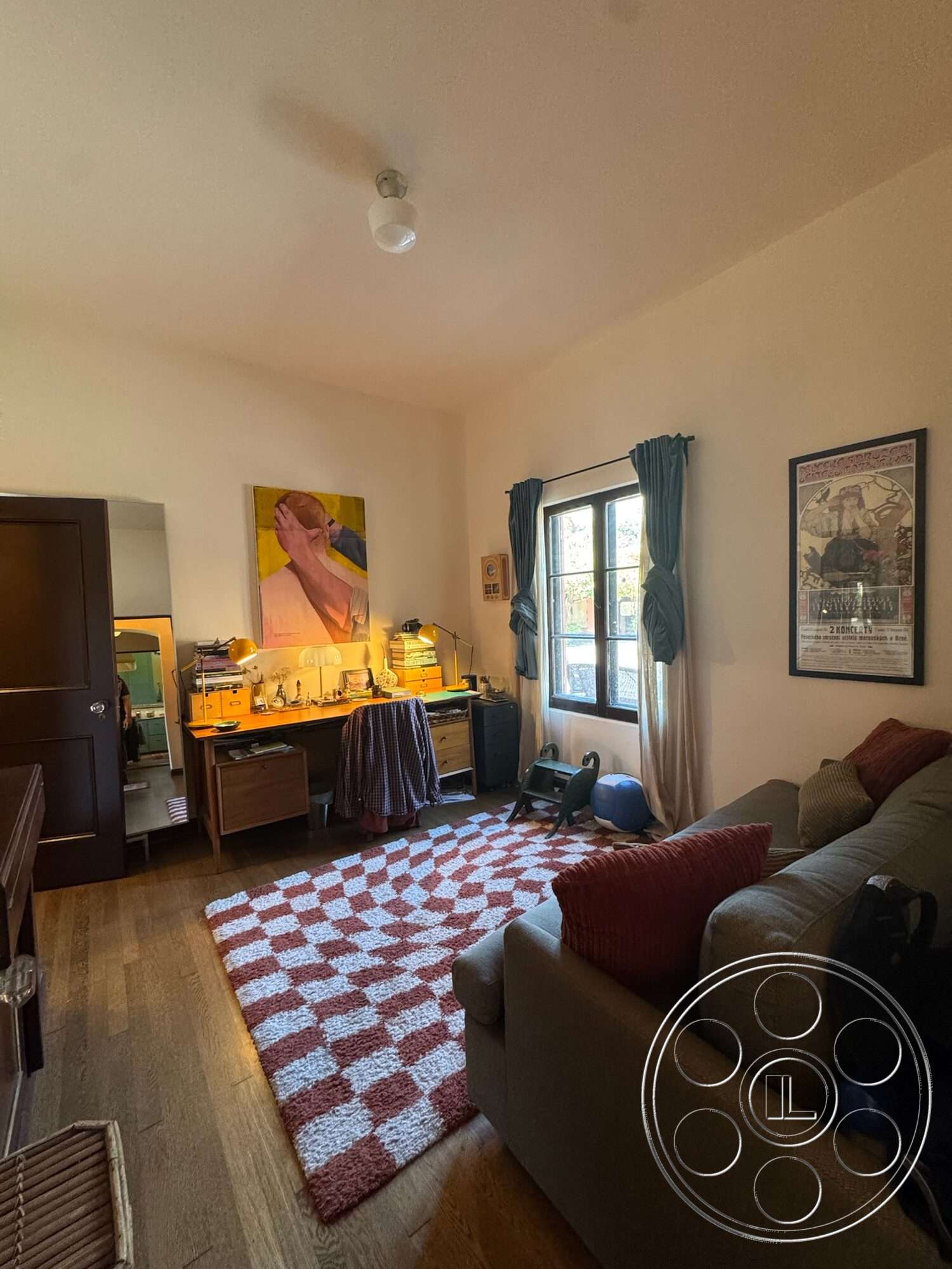 Farmstead Garden - artwork on wall, exposed ceiling, textured plaster walls, checkered area rug, hardwood bedroom floors, modern desk setup, home office space, interior lighting fixture, window with curtain treatment, traditional window
