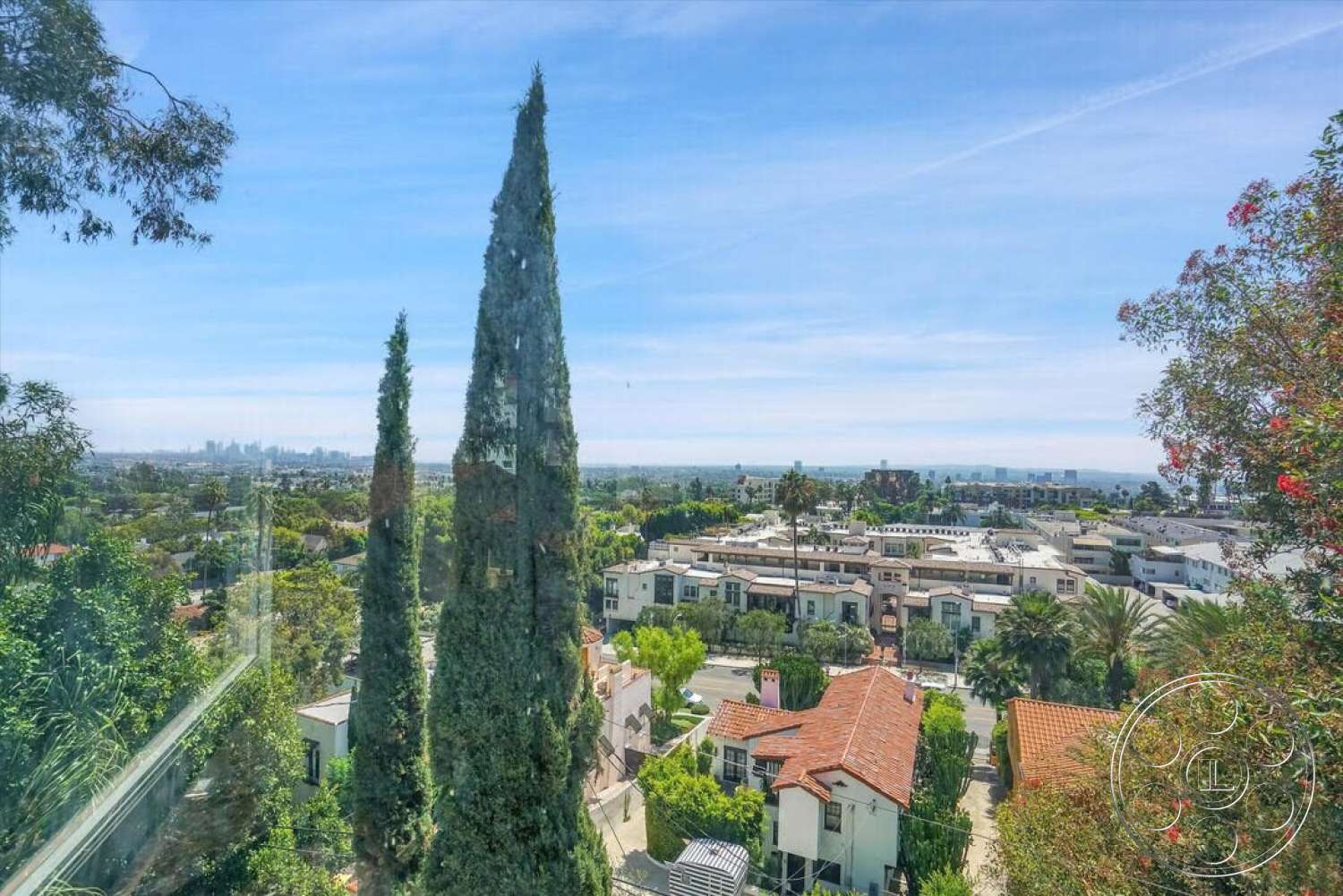 Spanish 170 - exterior, residential neighborhood, urban setting, modern architectural style, city skyline view, tall cypress trees, terracotta roof tiles, panoramic landscape, lush greenery landscaping, sunny weather