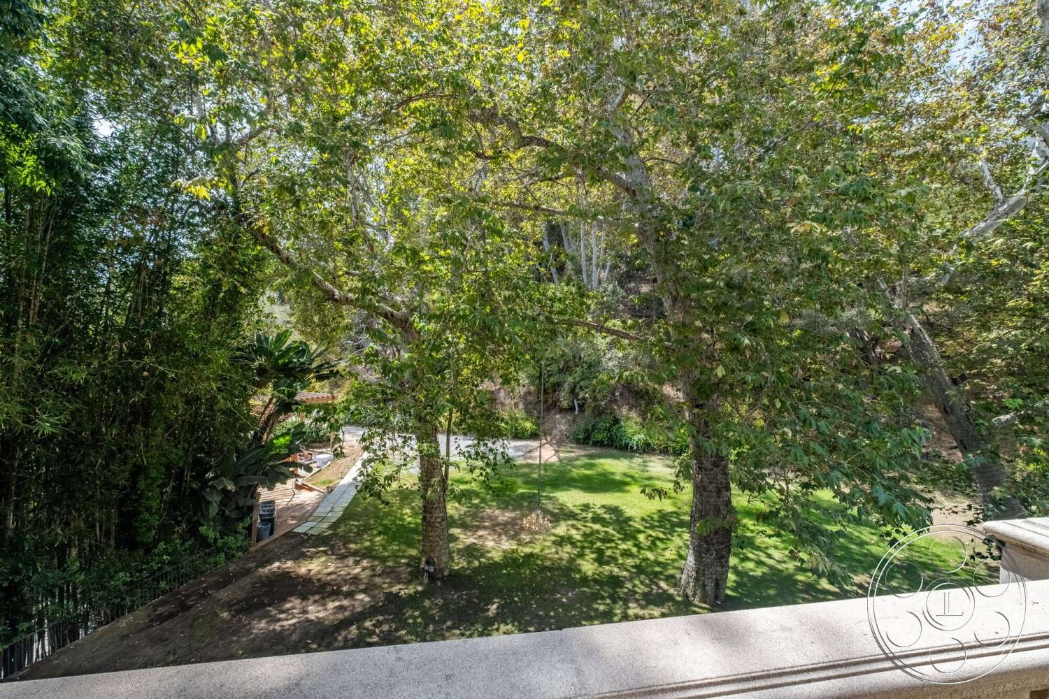 French 29 - exterior, mature trees, stone pathway, wood deck, well-maintained lawn, lush landscape garden, bamboo plantings, natural green setting