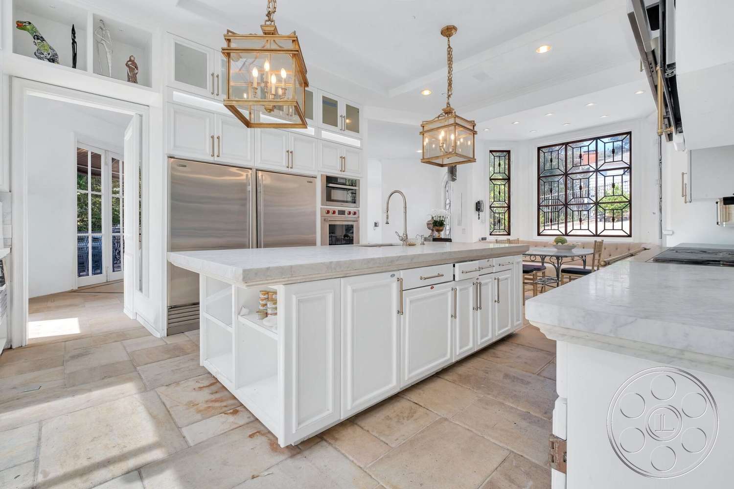 French 29 - modern kitchen, stainless steel appliances, white cabinetry, textured stone flooring, glass pendant lighting, interior kitchen, open layout design, marble countertop island, decorative glass windows, built-in oven and stovetop