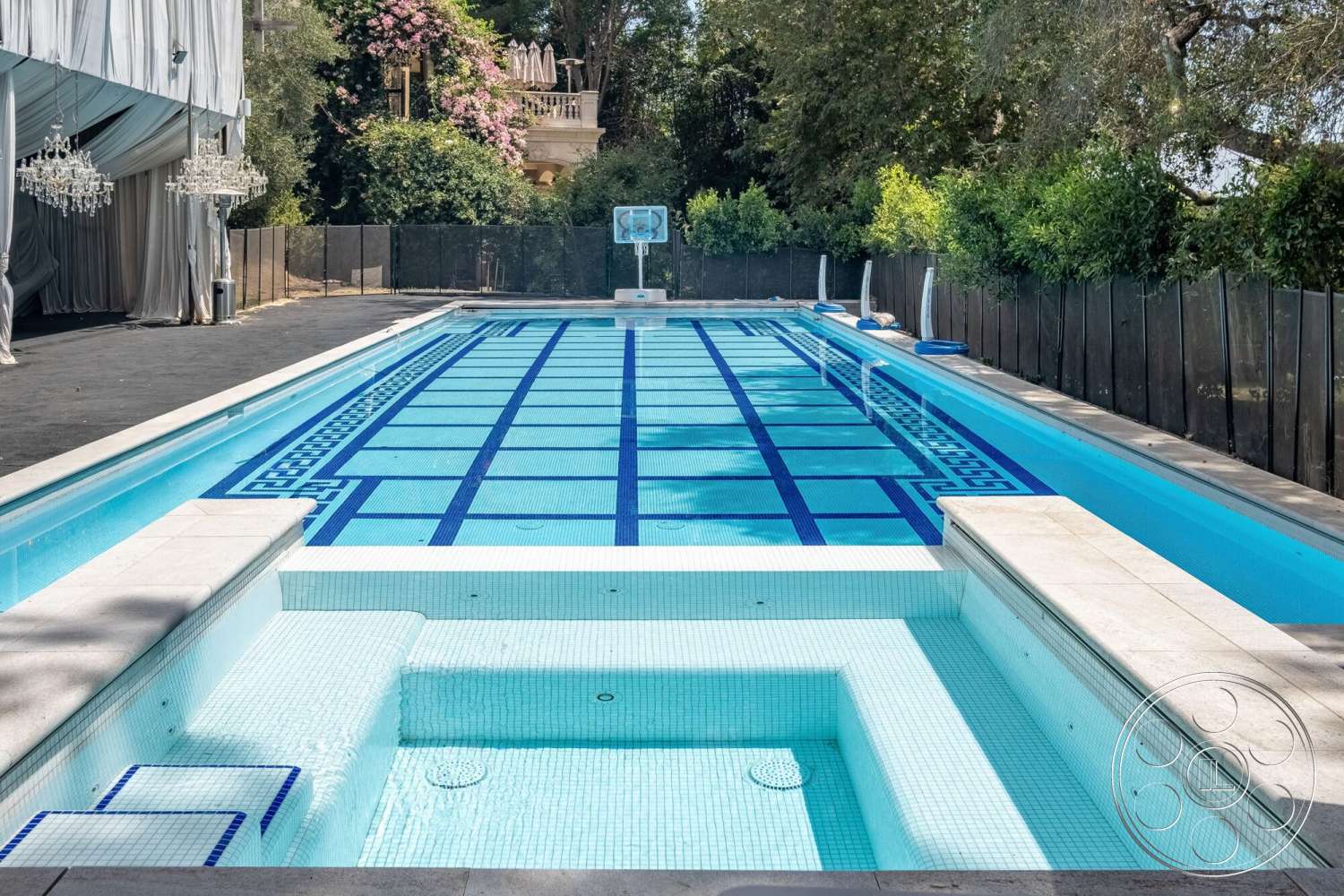 French 29 - rectangular pool, outdoor entertainment space, landscaped garden area, concrete pool coping, exterior swimming pool, mosaic tile pool flooring, white stone pool deck, in-ground spa, tile border design, wooden poolside loungers, safety glass pool fencing