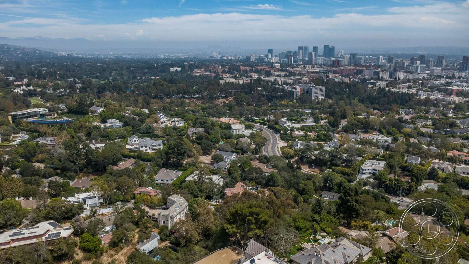 French 29 - exterior, suburban neighborhood, mature trees, urban setting, city skyline view, mountain view, decorative brickwork, landscaped front yards, tile roofs, two-story homes, asphalt driveways, wood fence enclosures, well-maintained gardens