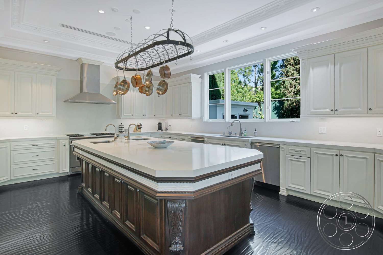 Medit 170 - open floor plan, modern appliances, white marble countertop, undermount sink, light oak cabinetry, interior kitchen, stainless steel range hood, hardwood kitchen floors, crown molding details, pendant light fixtures, double-pane windows, dark wood kitchen island, kitchen pantry