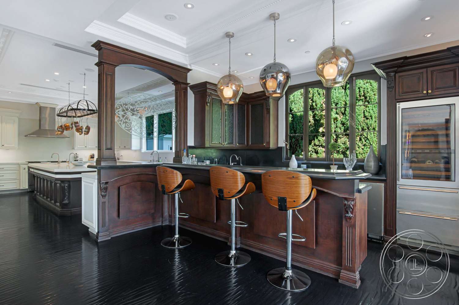 Medit 170 - open layout, stainless steel appliances, wood cabinetry, floor-to-ceiling windows, marble countertop, hardwood floor, arched doorway, glass pendant lighting, modern bar stools, chef's kitchen, paneled walls, built-in glass-front cabinets, dark wood kitchen island