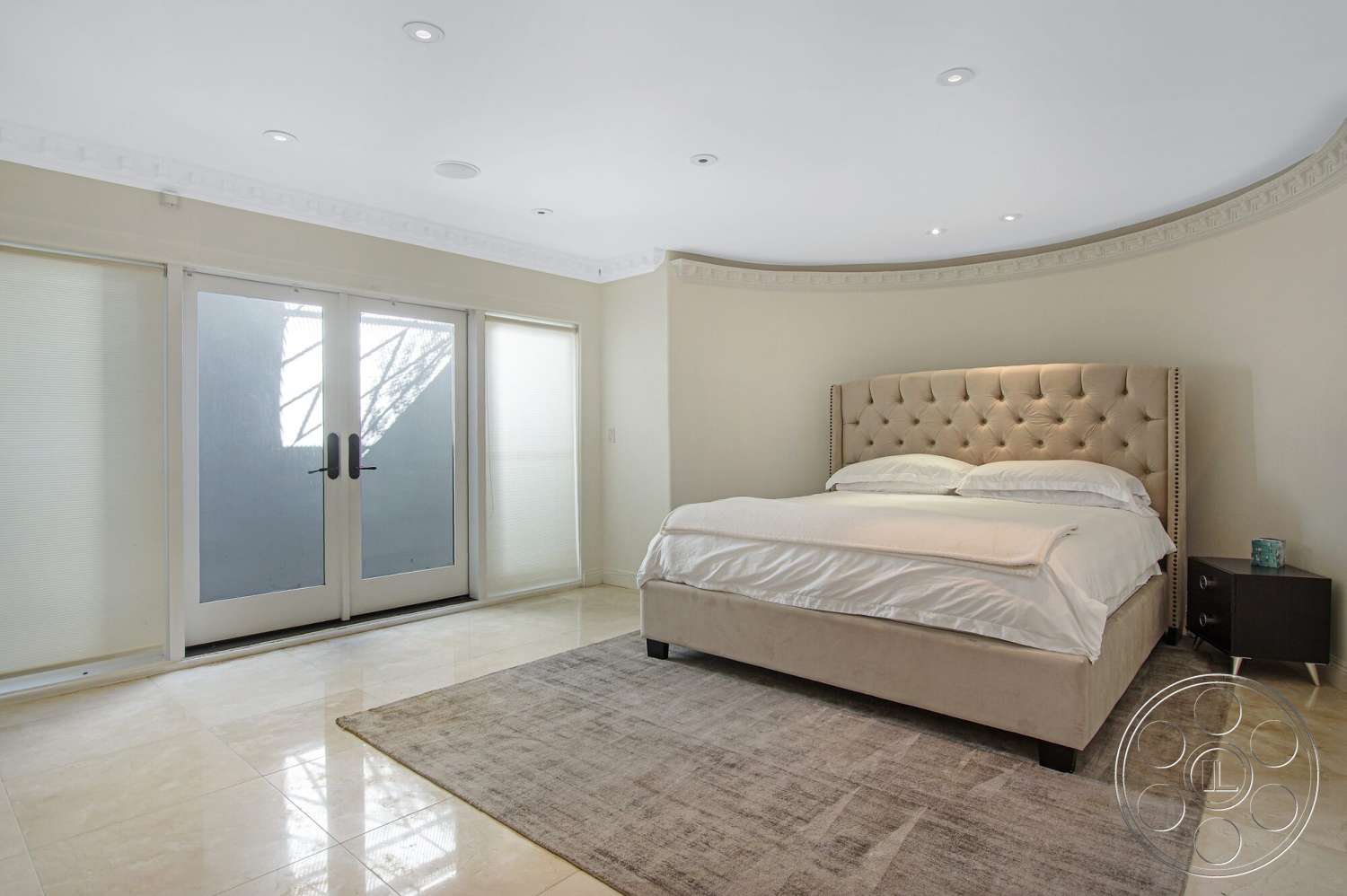 Medit 170 - natural light, area rug, curved wall design, modern nightstand, sheer window treatments, recessed ceiling lights, tufted headboard, crown molding details, marble bedroom flooring, double door entryway, upholstered bed frame