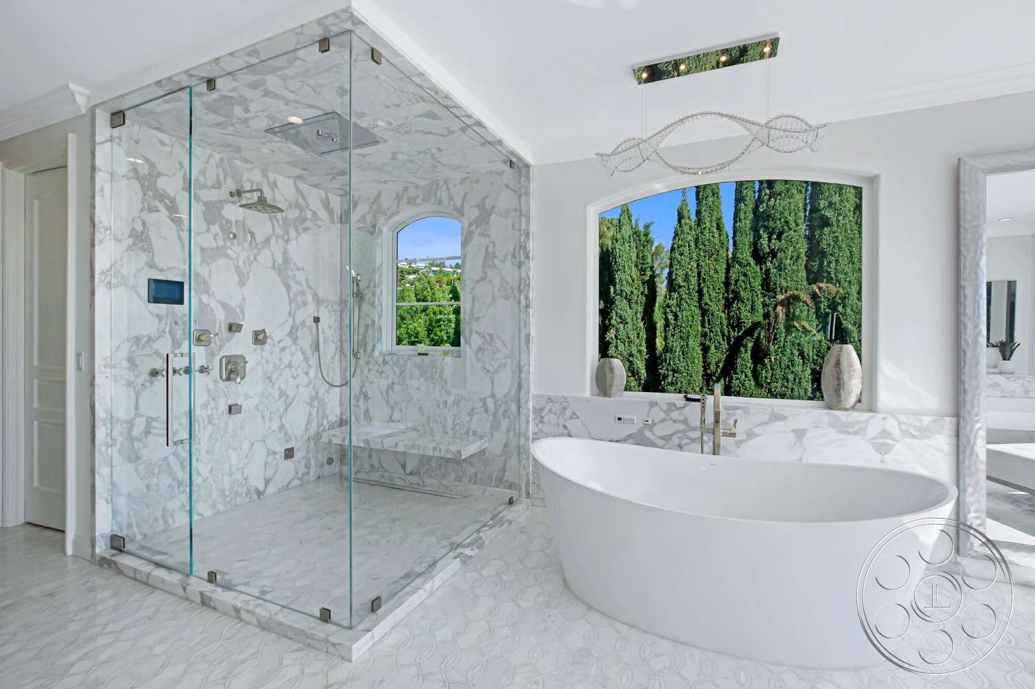 Medit 170 - glass shower enclosure, greenery view, chrome fixtures, freestanding oval bathtub, crown molding details, marble shower walls, marble bathroom flooring, contemporary light fixture, luxurious spa-like atmosphere, single-panel glass door, marble shower bench, keyhole window
