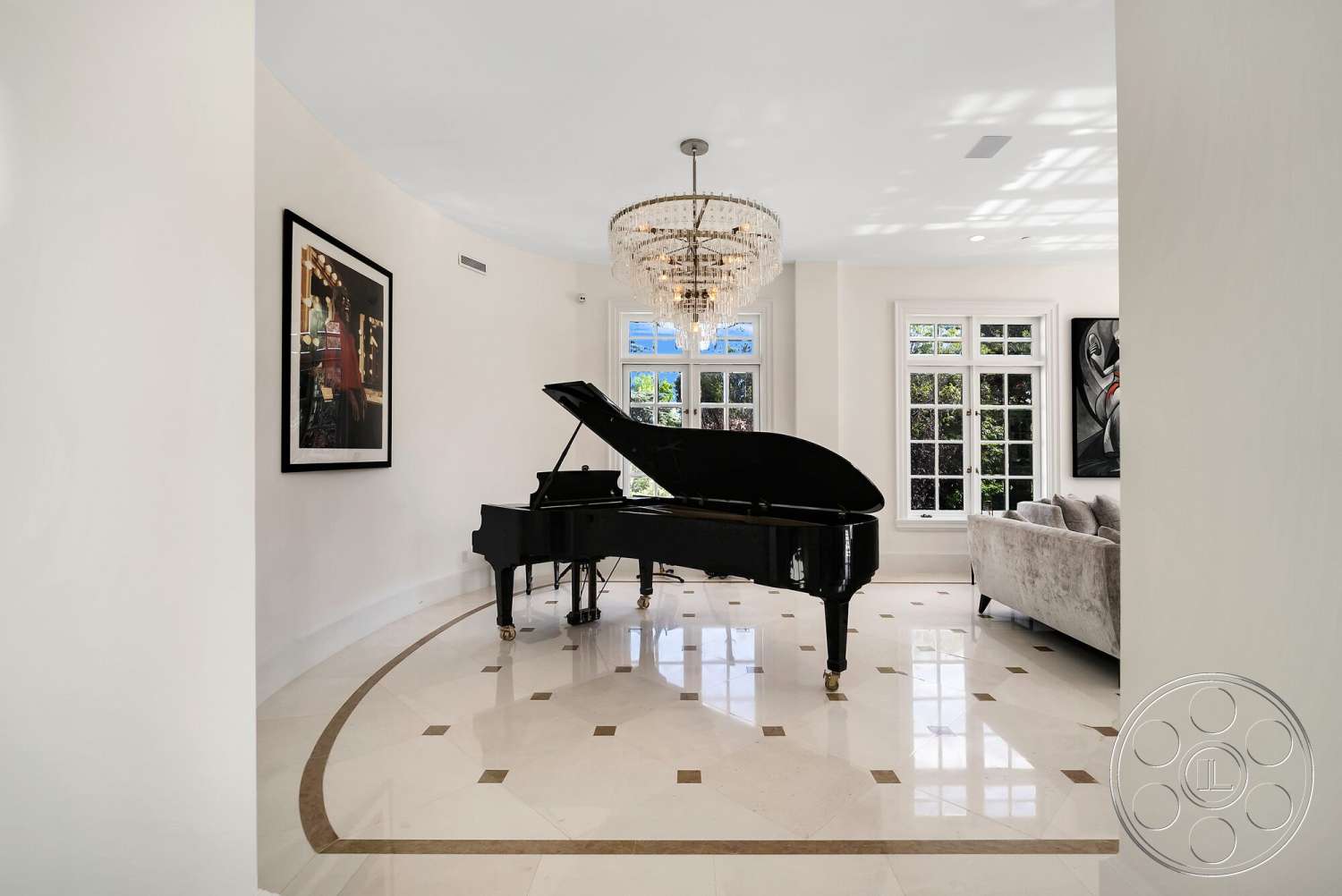 Medit 171 - artwork on walls, black grand piano, vaulted ceiling, marble flooring, curved wall design, textured sofa, white painted walls, chandelier lighting fixture, large bay windows, polished marble entryway floor, decorative mosaic border
