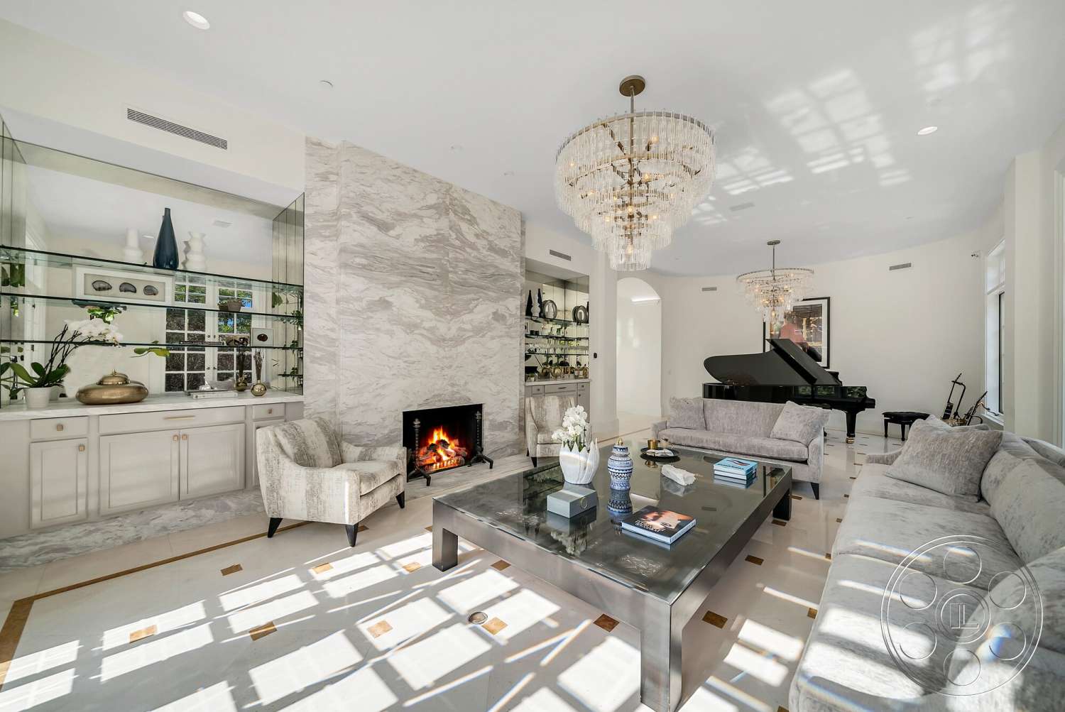 Medit 171 - plant accents, floor-to-ceiling windows, black grand piano, chandelier lighting, marble feature wall, hardwood accents, contemporary coffee table, glossy tile flooring, neutral painted walls, glass display shelves, curved room layout, luxury sofa upholstery, fireplace with a modern design, gold accented decor