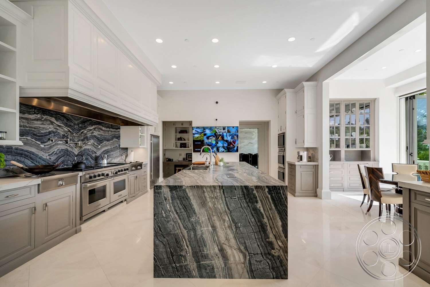 Medit 171 - high ceilings, neutral color palette, stainless steel appliances, open concept layout, modern pendant lighting, luxurious finishes, floor-to-ceiling windows, contemporary dining area, interior kitchen, built-in kitchen storage, grey marble backsplash, polished porcelain tile flooring, white lacquered cabinetry, elegant kitchen design, marble kitchen island with veining