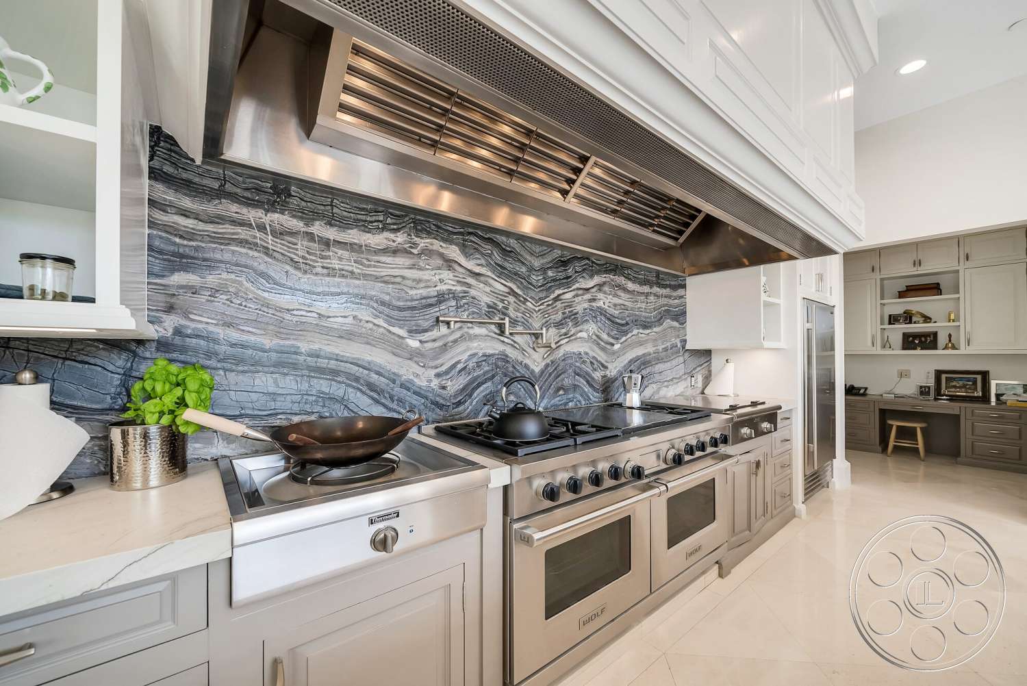 Medit 171 - stainless steel appliances, open shelving, under-cabinet lighting, interior kitchen, marble kitchen backsplash, polished porcelain tile floors, custom cabinetry with light gray finish, professional-grade gas range, modern hood vent, wooden kitchen stool
