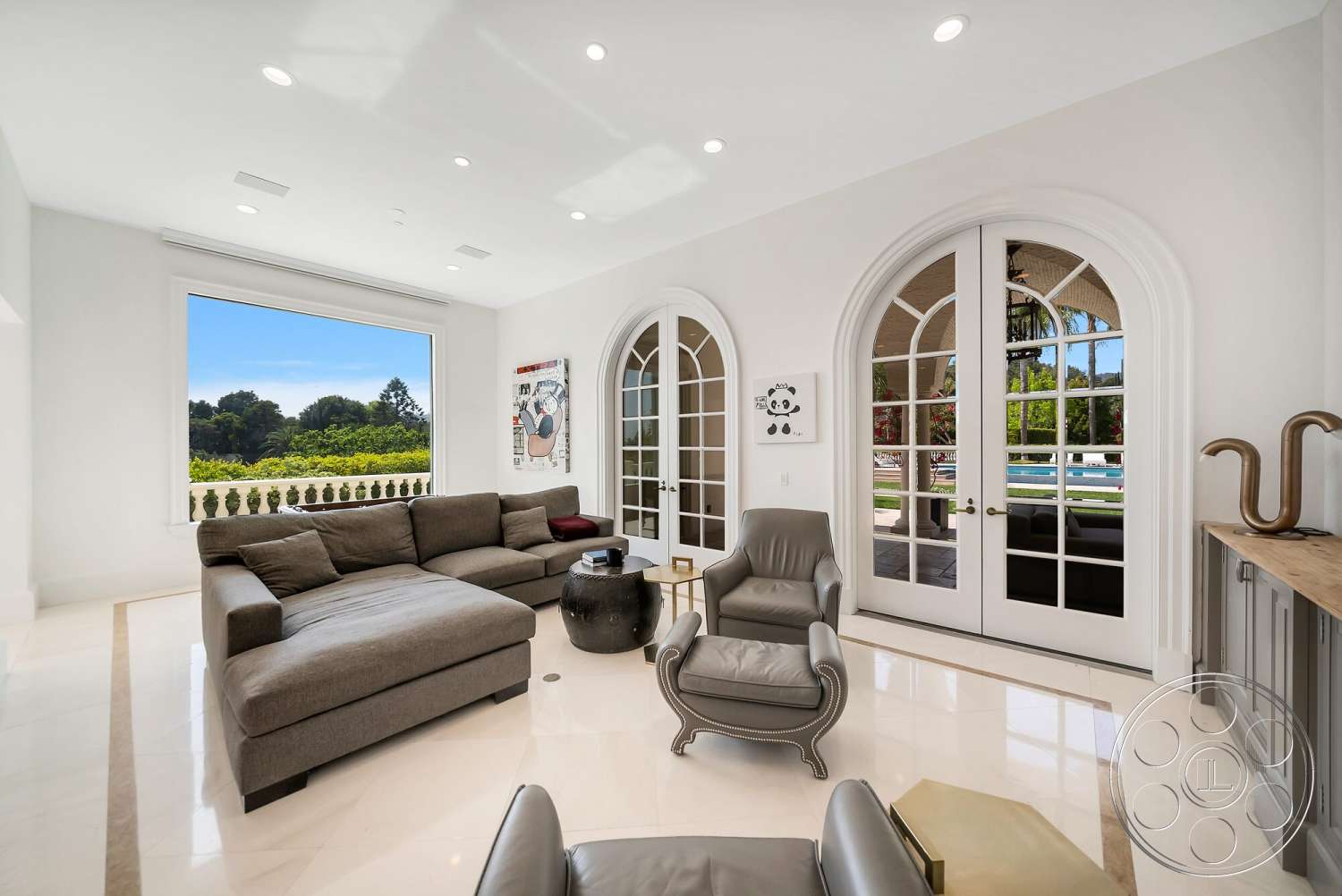 Medit 171 - neutral color palette, open floor plan, decorative wall art, marble flooring, contemporary armchair, elegant crown molding, wood accent table, modern sectional sofa, bright and airy ambiance, large windows with view, arched glass doors