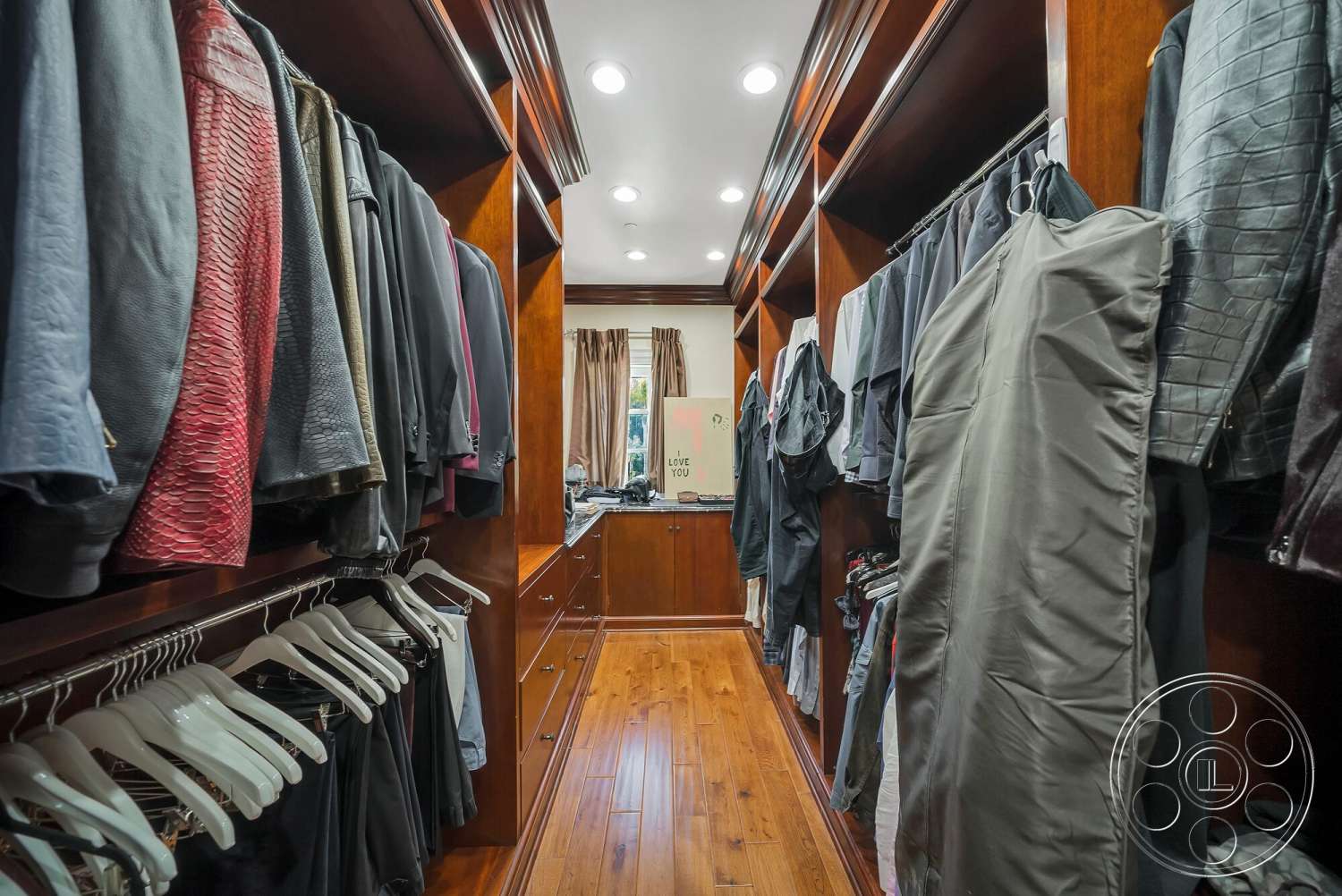 Medit 171 - hardwood flooring, recessed lighting, custom cabinetry, interior walk-in closet, draped window treatments, hanging clothing racks, wood paneling shelves
