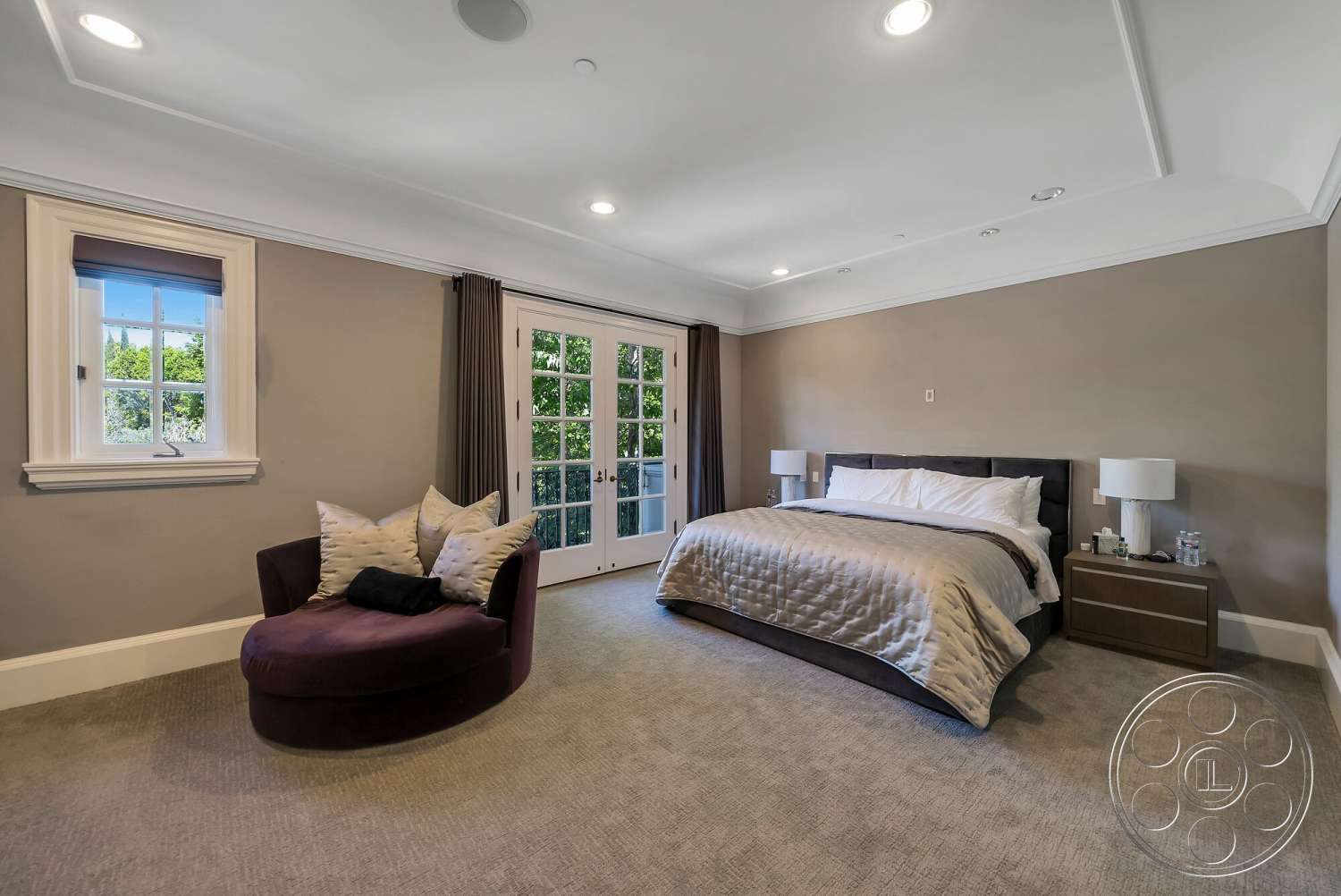 Medit 171 - vaulted ceiling, textured plaster walls, double French doors, decorative throw pillows, accent chair, queen-sized bed, crown molding details, carpet bedroom flooring, nightstand with lamps, large windows with trim