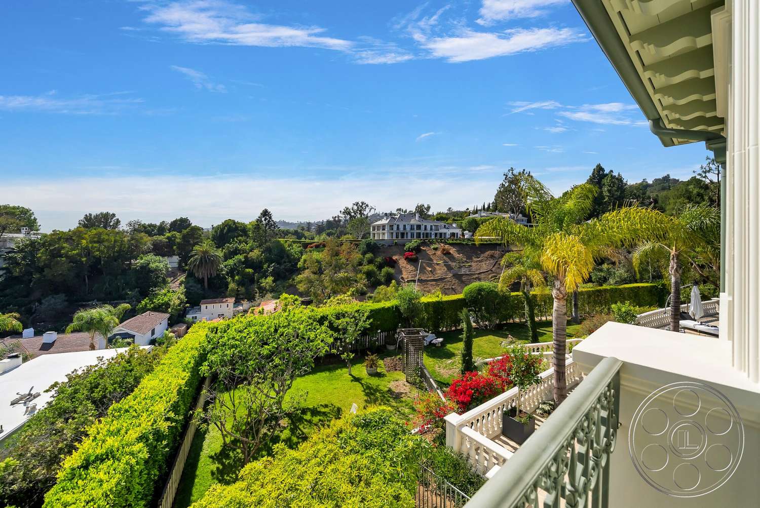 Medit 171 - exterior, palm trees, city skyline view, flowering plants, terraced landscaping, lush garden landscape, contemporary home architecture, balcony railing, green hillside setting, hedge privacy fencing, multi-level garden