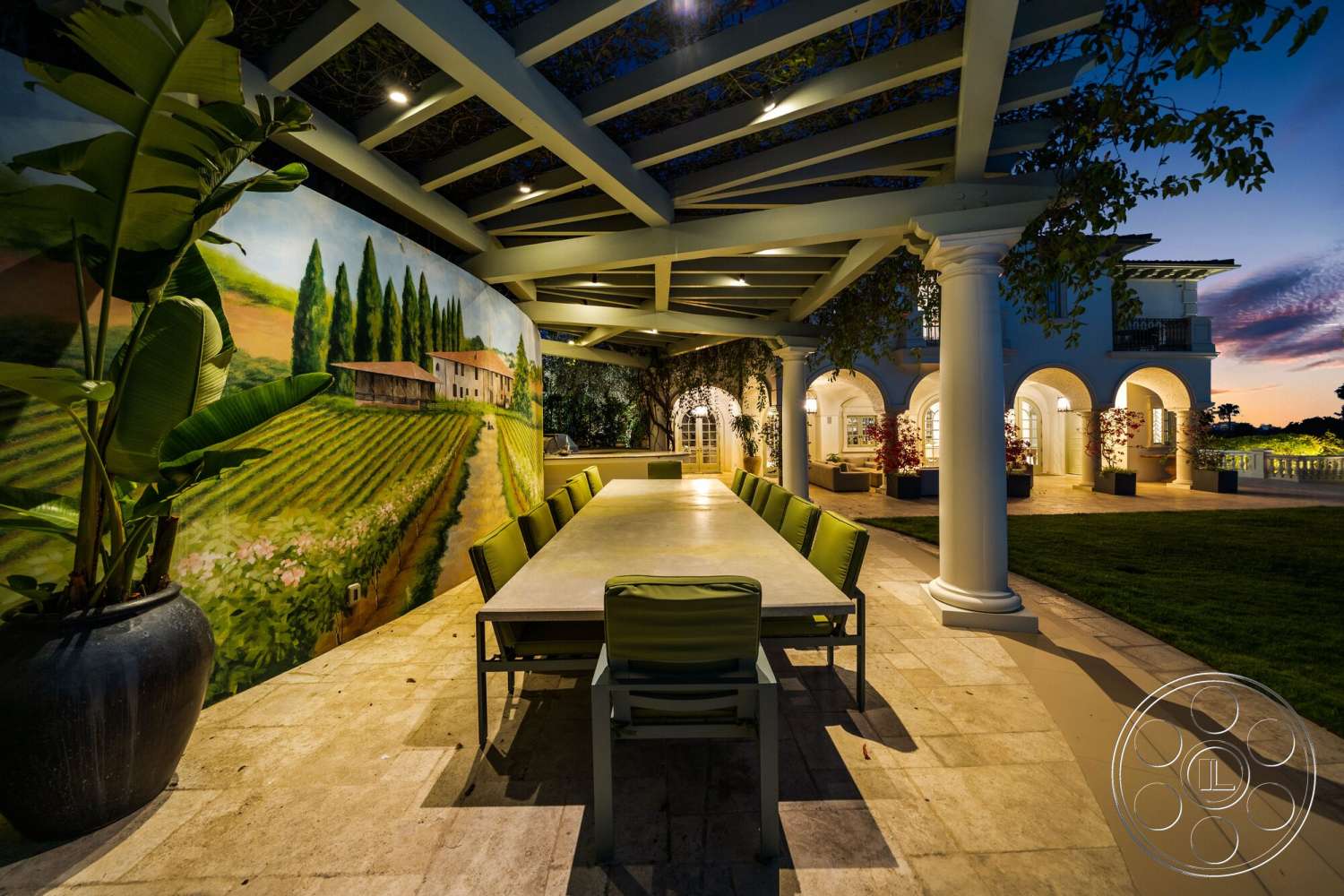 Medit 171 - exterior, floor-to-ceiling windows, outdoor lighting fixtures, structural columns, urban garden setting, stone patio flooring, stucco wall treatment, lush greenery accents, painted mural wall, large outdoor dining table, slate tile floor, pergola roof, expansive vineyard view