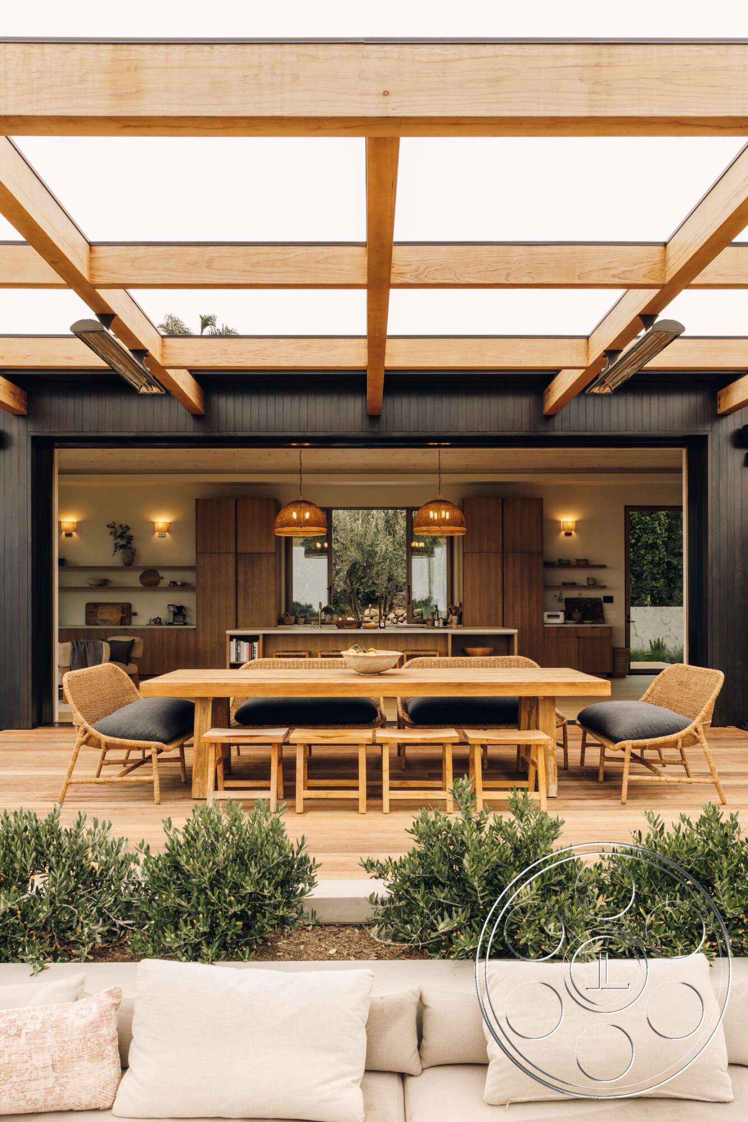 Modern 533 - dark wood cabinetry, exterior, wood dining table, glass sliding doors, modern outdoor lighting, landscape greenery, wood beam pergola, wood deck flooring, contemporary outdoor living area, woven rattan dining chairs