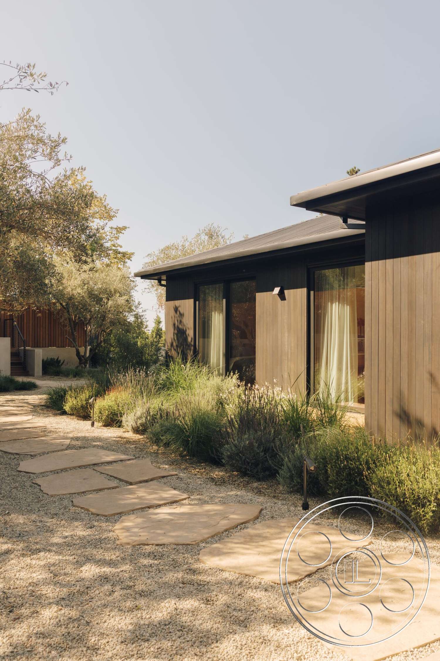 Modern 533 - exterior, large glass windows, modern architectural style, gravel landscaping, flat roof design, native plant garden, minimalist house facade, slab stone pathway, wood paneling house exterior