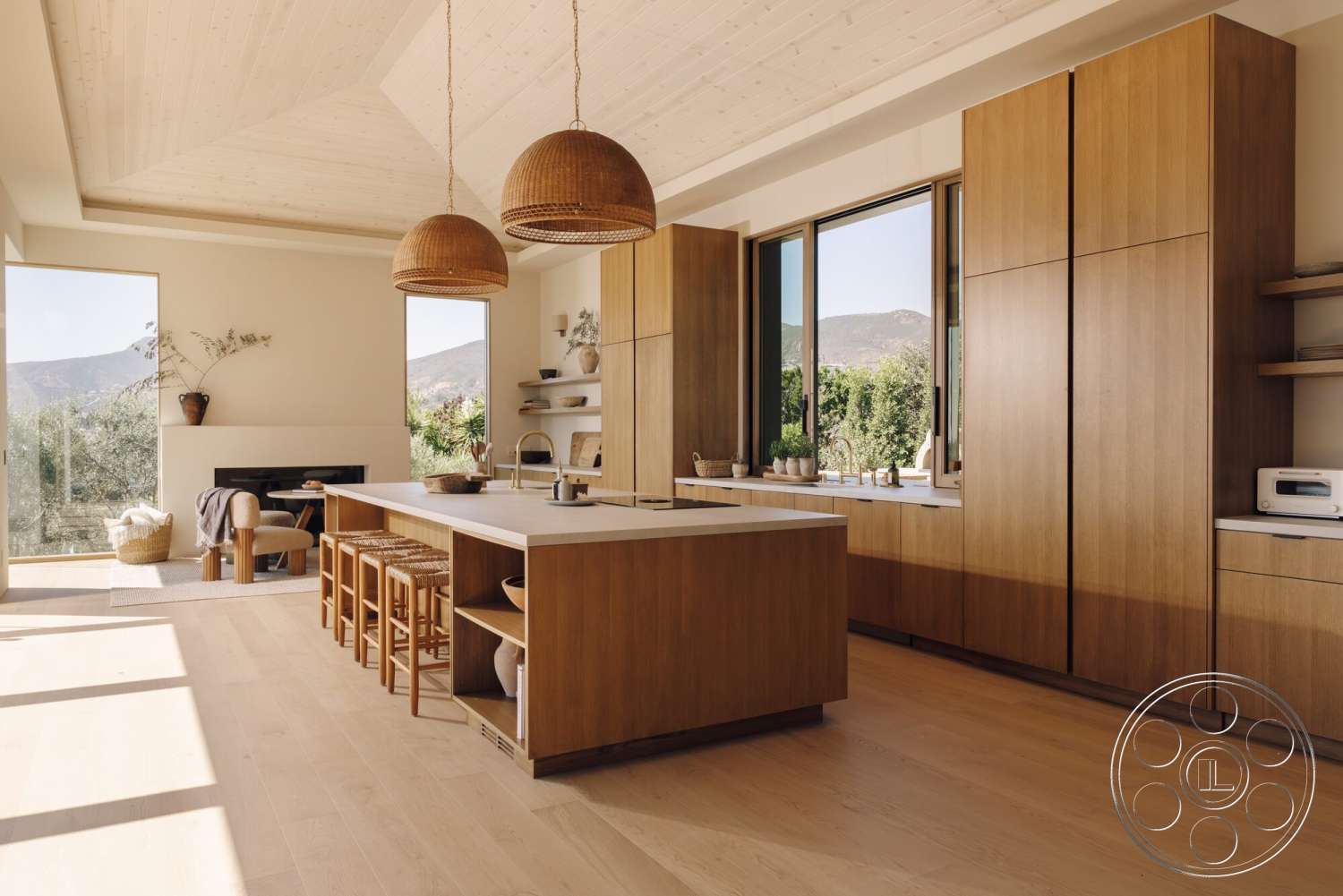 Modern 533 - natural light, minimalist design, light hardwood flooring, wood cabinetry, floor-to-ceiling windows, modern kitchen island, white quartz countertop, modern kitchen design, exposed wood ceiling beams, open-concept kitchen, white painted walls, pendant light fixtures, scenic mountain view, walnut finish cabinets