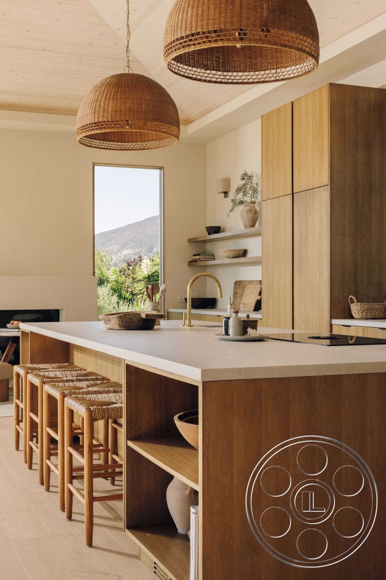 Modern 533 - neutral color palette, light wood flooring, open shelving, concrete kitchen countertop, wooden kitchen cabinets, minimalist kitchen design, woven hanging light fixtures, large window with mountain view, breakfast bar with wooden stools