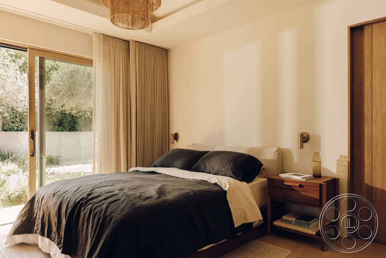 Modern 533 - king-size bed, floor-to-ceiling windows, textured plaster walls, simple bedside lamp, fabric curtains, wood nightstand, natural light setting, hardwood bedroom floors, dark bedding, wood sliding door, light bedding accents, built-in closet door