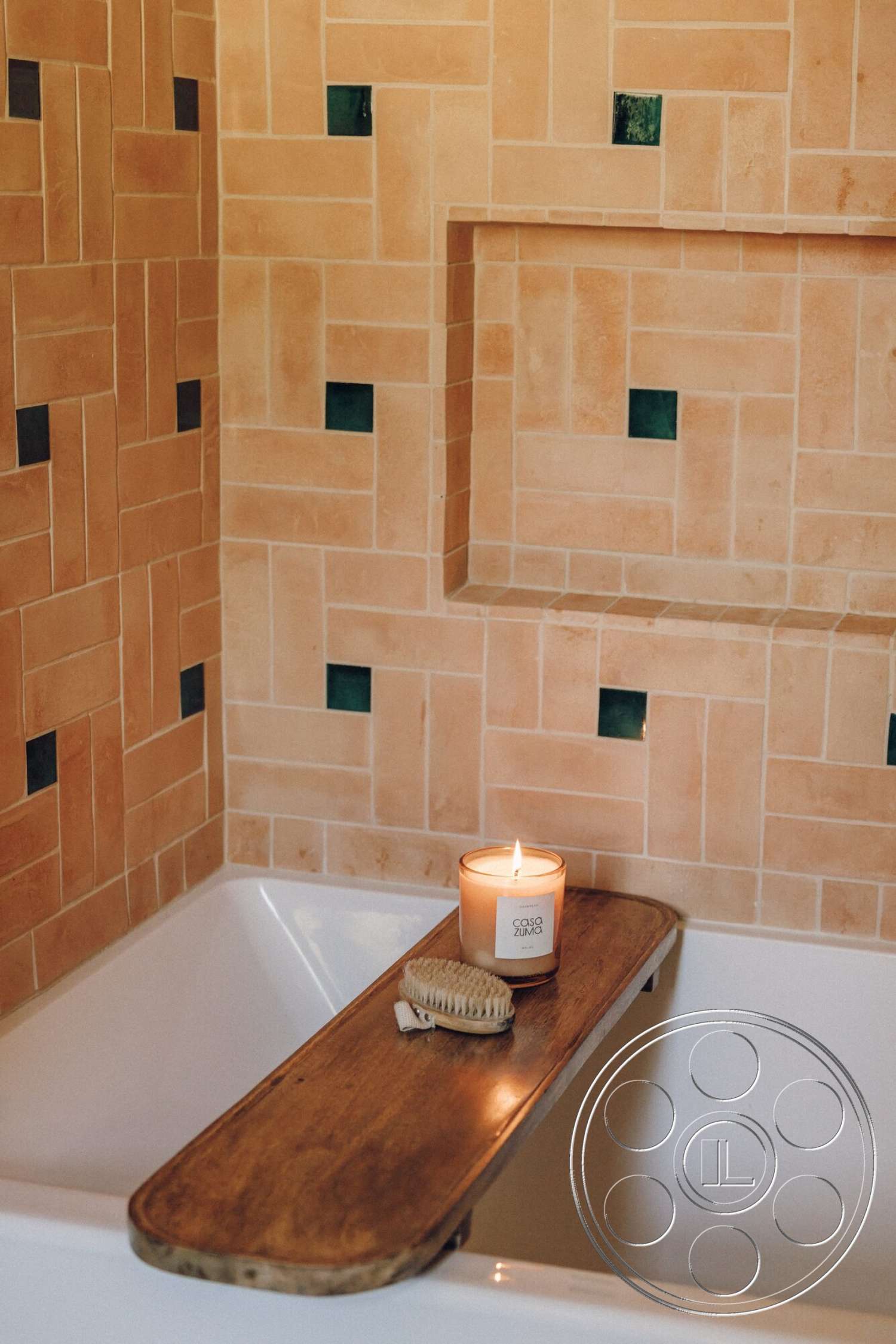 Modern 533 - decorative candle, minimalist bathroom decor, tile bathroom walls, beige ceramic tiles, green accent tiles, bathtub with wood shelf, wood bathtub caddy