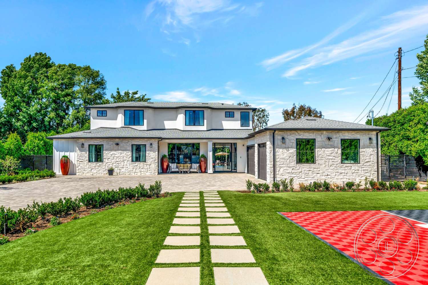 Modern 534 - exterior, flat roof, landscaped front yard, green lawn, decorative planters, horizontal wood fencing, modern architectural style, concrete driveway, gabled roof, wooden garage door, rectangular windows, two-story home, paver walkway, stone exterior walls