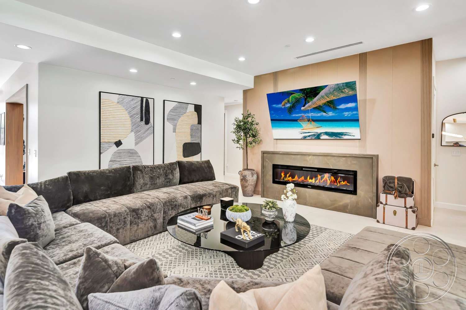 Modern 534 - neutral color palette, recessed lighting, textured area rug, abstract wall art, glass coffee table, light wood accent wall, decorative plant accents, plush velvet sectional sofa, wall-mounted flat-screen television, modern stone fireplace, stylish decor accessories