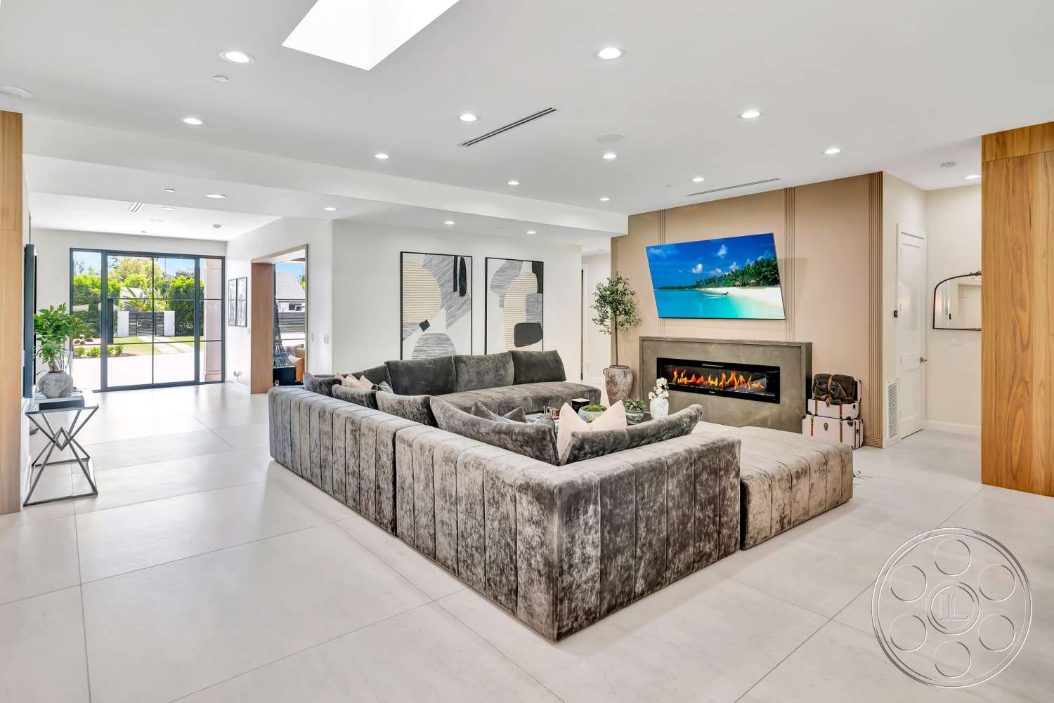 Modern 534 - neutral color palette, natural light, minimalist design, open floor plan, concrete flooring, floor-to-ceiling windows, wood accent wall, rectangular coffee table, plaster wall finish, decorative plant accents, modern fireplace surround, contemporary art pieces, large sectional velvet sofa, tranquil garden view, smart TV wall mount
