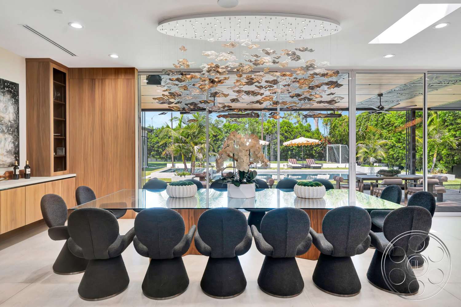 Modern 534 - minimalist design, open floor plan, upholstered dining chairs, landscape view, pendant light fixture, marble dining table, modern dining area, skylight ceiling, glass wall panels, concrete floor tiles, wood panel kitchen cabinets